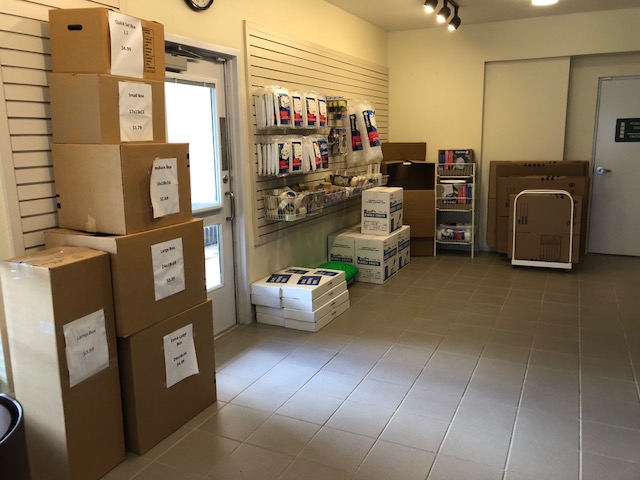 moving supplies and boxes arranged along a wall