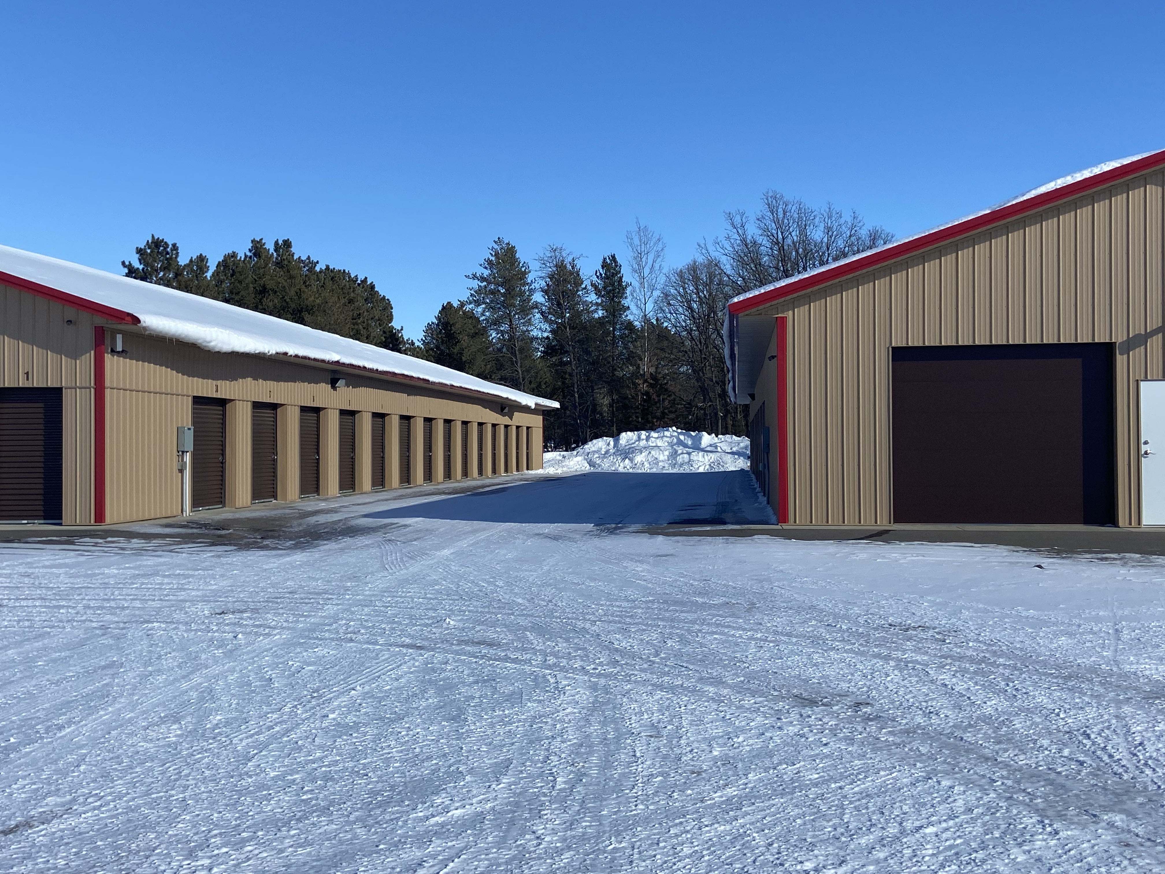 two buildings with drive up access storage units