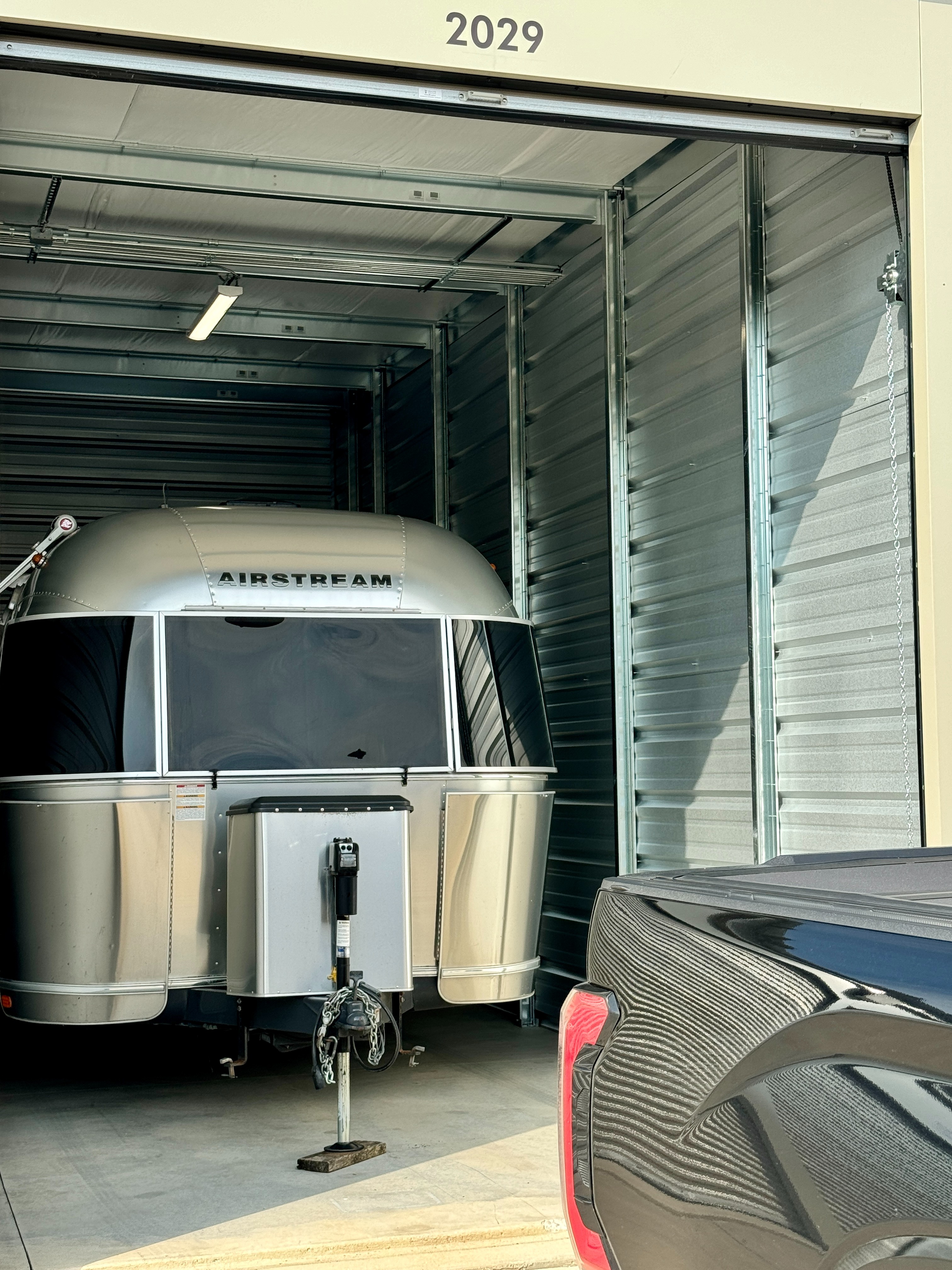 Airstream travel trailer stored in large RV storage unit 2029 at Storage Junction in Genoa City, WI