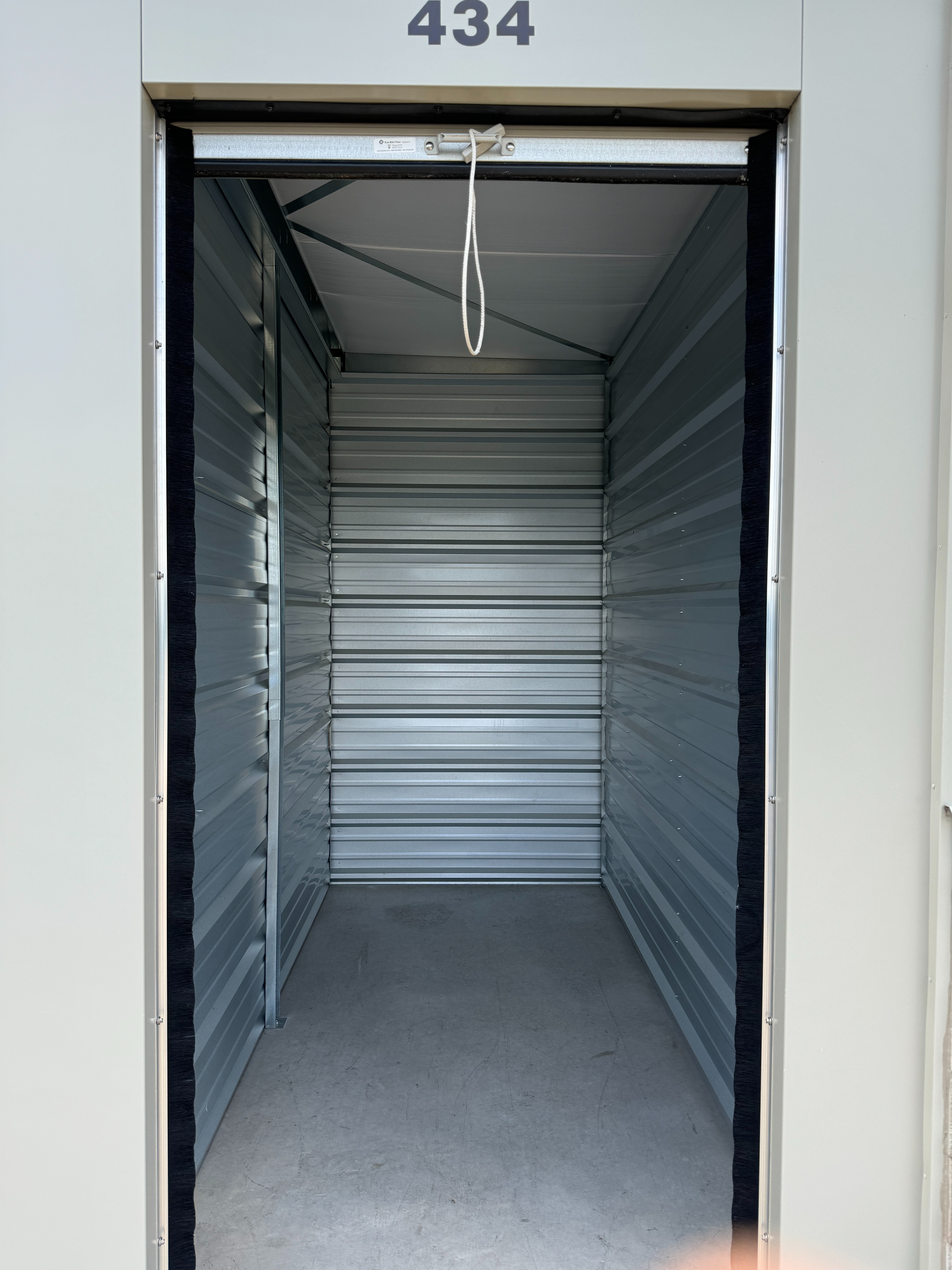 Clean, well-lit small self storage unit interior at Storage Junction in Genoa City, WI
