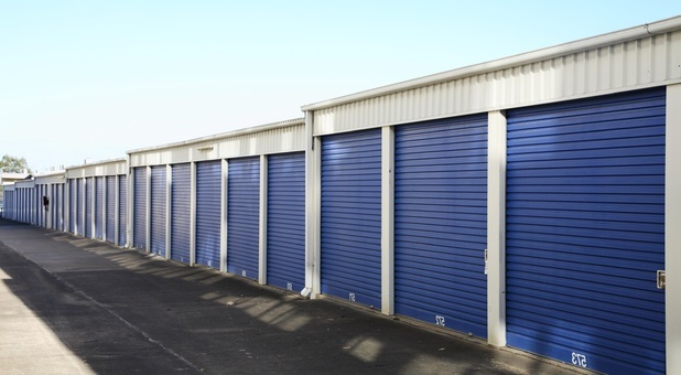 Row of blue Arrow Self Storage units