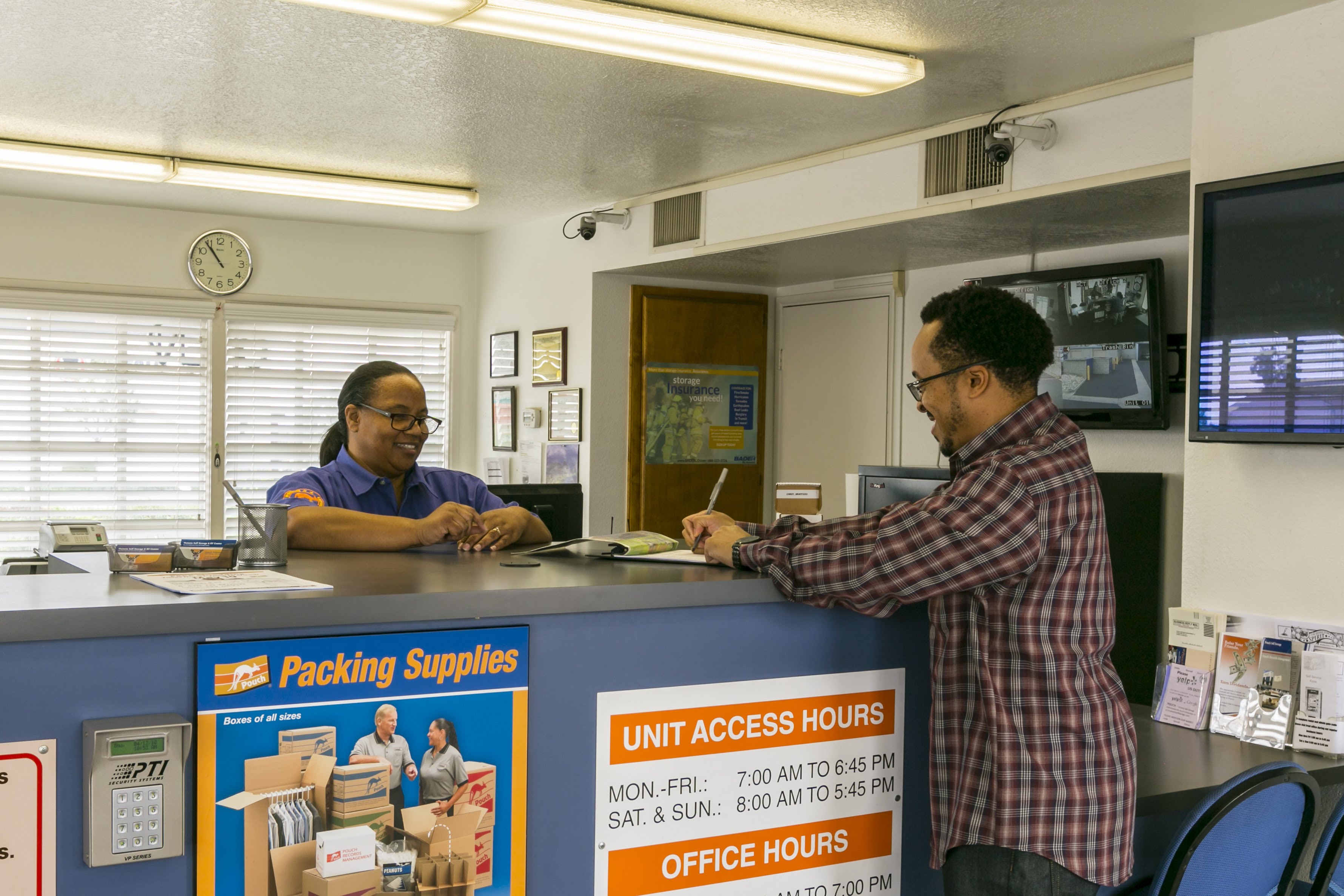 Self Storage counselor assisting a tenant