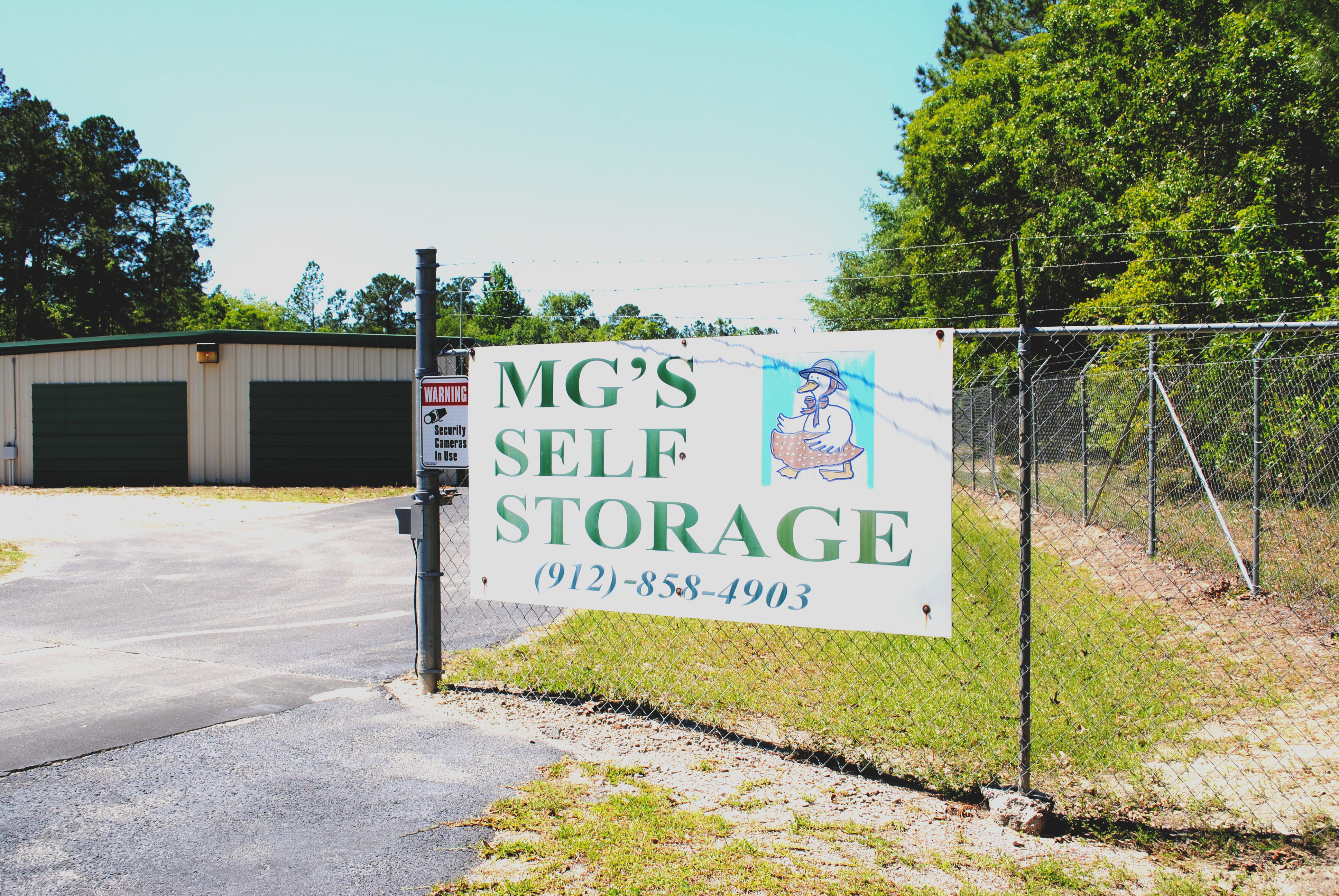 MG's Self Storage gate and fenced