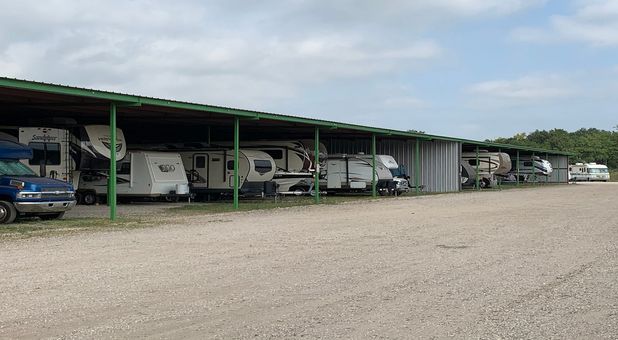 RVs and boats stored under covered parking structure outside GreenFill Cypress, TX 77433, Covered Parking and Storage for RVs, Boat, Car