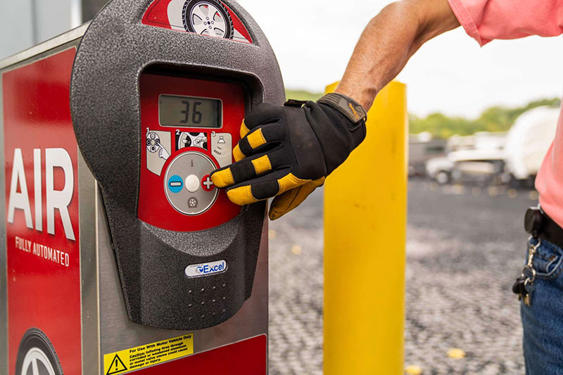 man-pushing-pressure-setting-buttons-on-air-machine-1.jpg