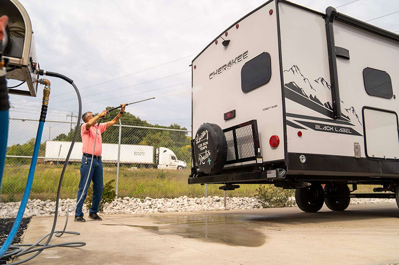 man-washes-rv-at-boat-and-rv-storage-facility.jpg
