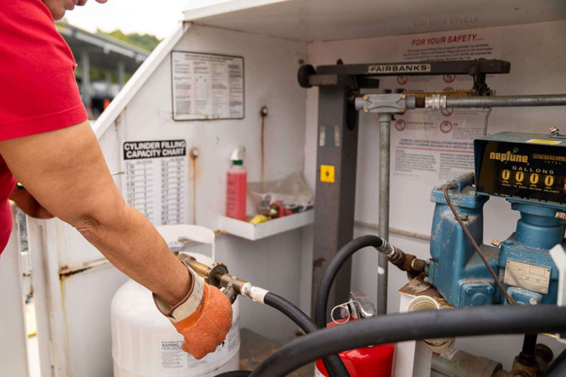 woman-adjusting-propane-valve-at-boat-and-rv-storage-facility.jpg