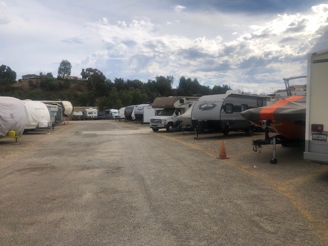 RVs, boats, and vehicles parked in a lot