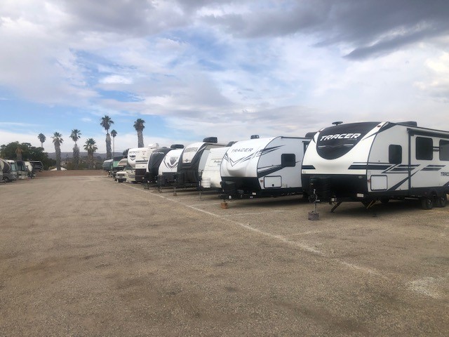 parked TV trailers in a storage lot