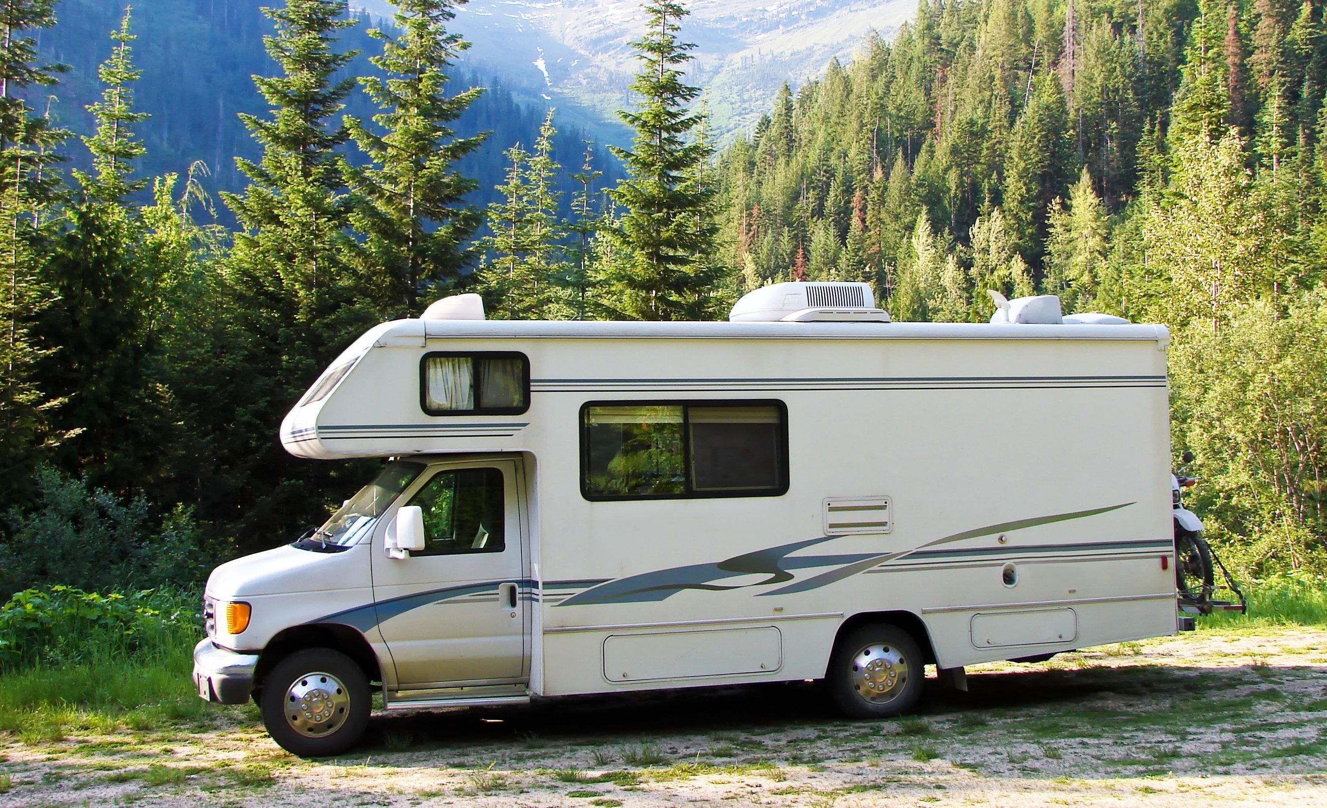 RV alone in front of landscape