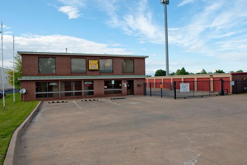 front office with fenced and gated entrance to storage facility