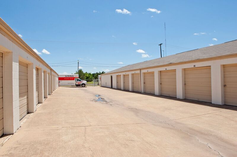 drive up access self storage buildings and a uhaul moving truck