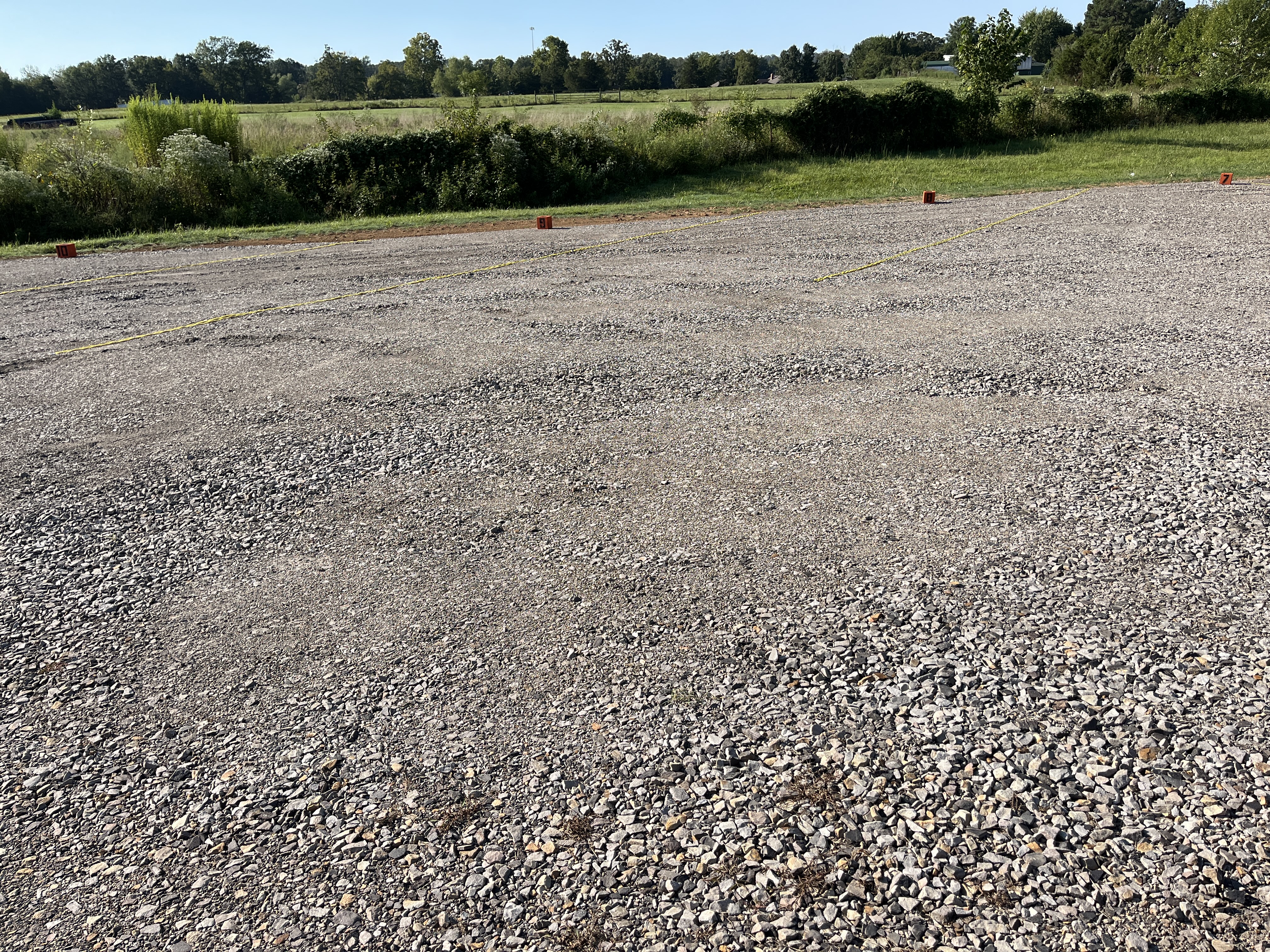 Outdoor boat and RV parking spaces on a gravel lot in greenwood, arkansas 