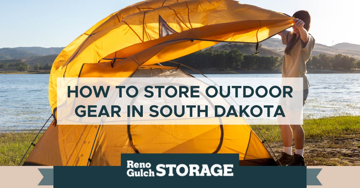 An image of a woman setting up a tent near a lake. A text banner reads, “How to store outdoor gear in South Dakota.”