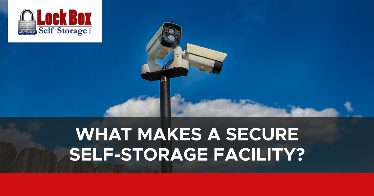 Photo of two security cameras mounted on a pole. A text banner reads “What makes a secure self-storage facility?”