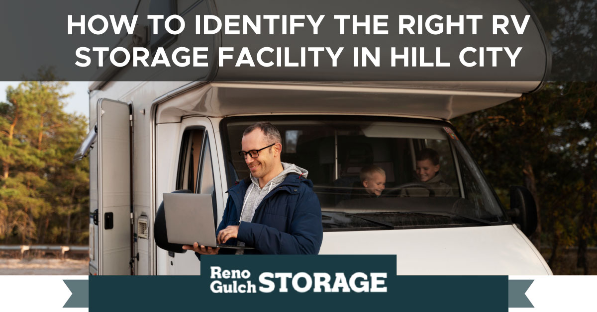 An image of a man looking at a laptop while standing next to his RV. A text banner reads “How to Identify the Right RV Storage Facility in Hill City.”