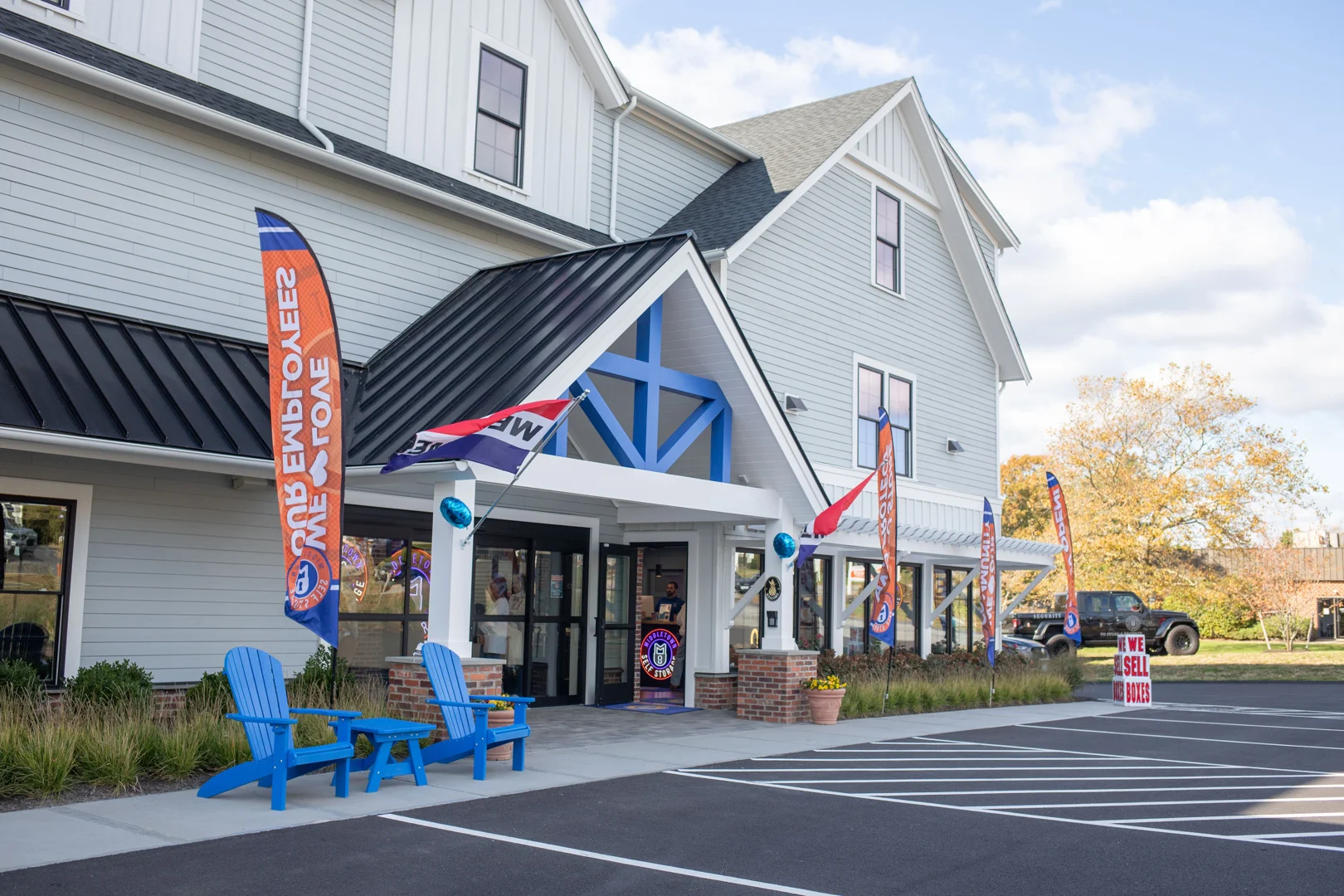 Modern, secure storage facility with gated entry and wide drive aisles - storage in newport ri