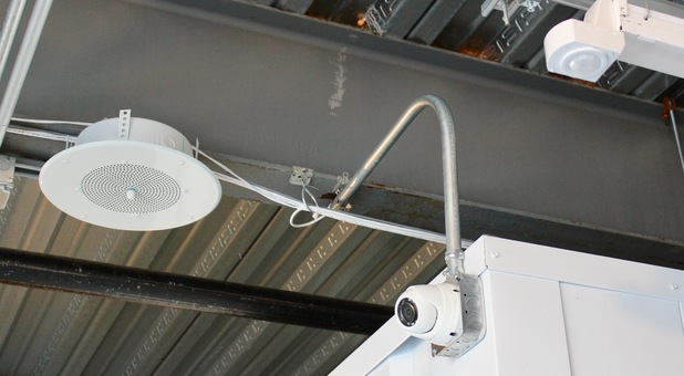 motion sensor ligthting, security cameras mounted inside a storage building