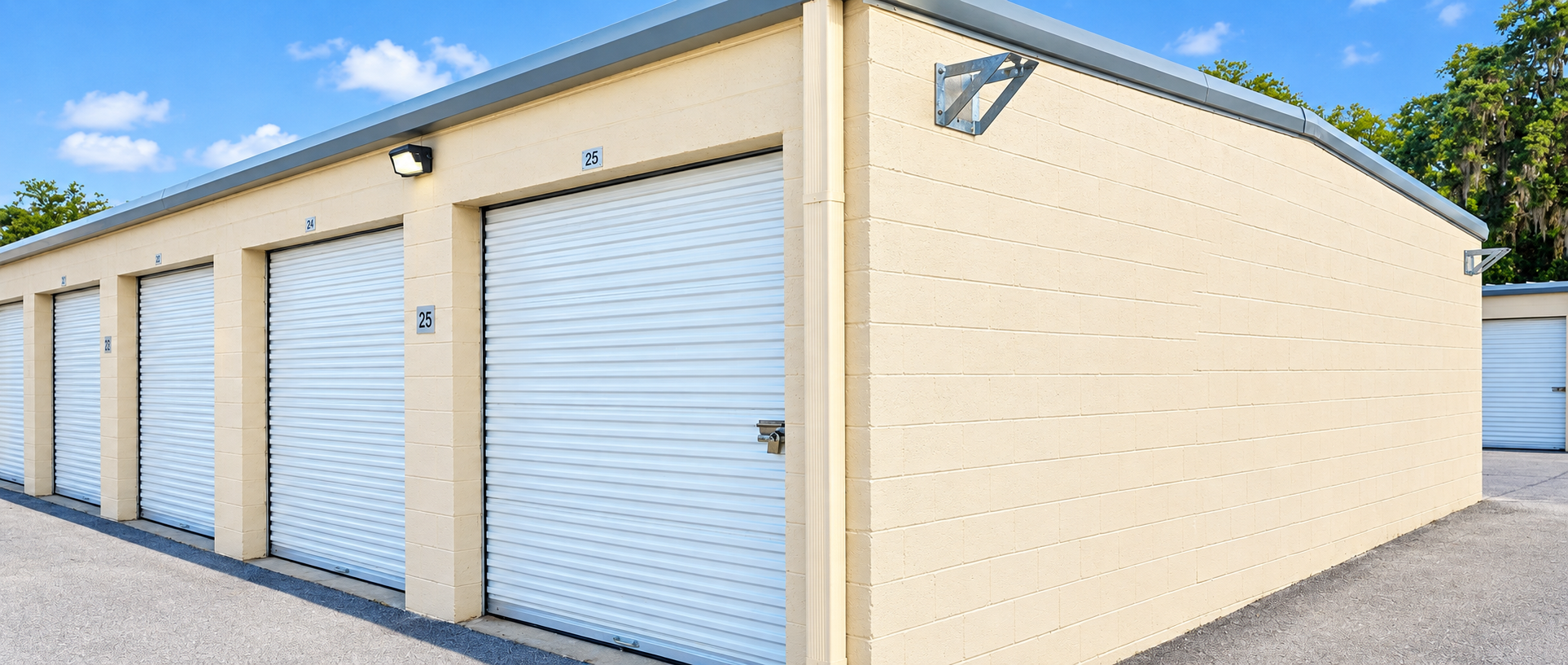Sunny row of drive-up storage units at Ocala Storage Park on SE Lake Weir Ave, Ocala, FL 34480