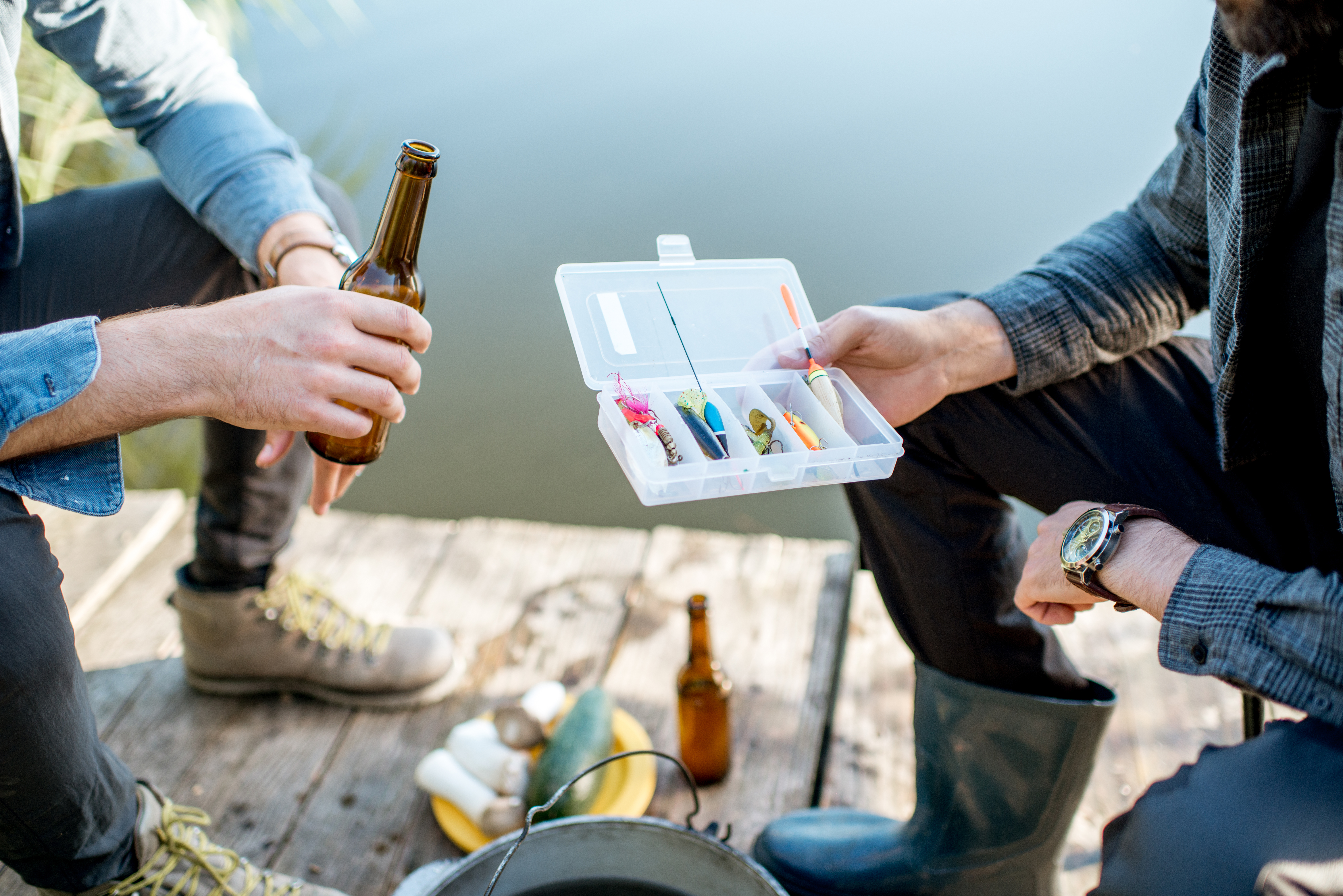 Holding Fishing Tackles During the Picnic