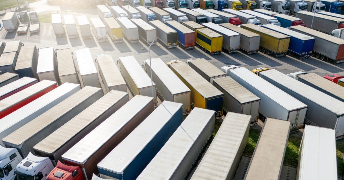 Semi-Truck Parking Industry Trends for 2026 A parking lot full of semi trucks. Almost all of the spots are filled, and there are multiple rows of trucks.