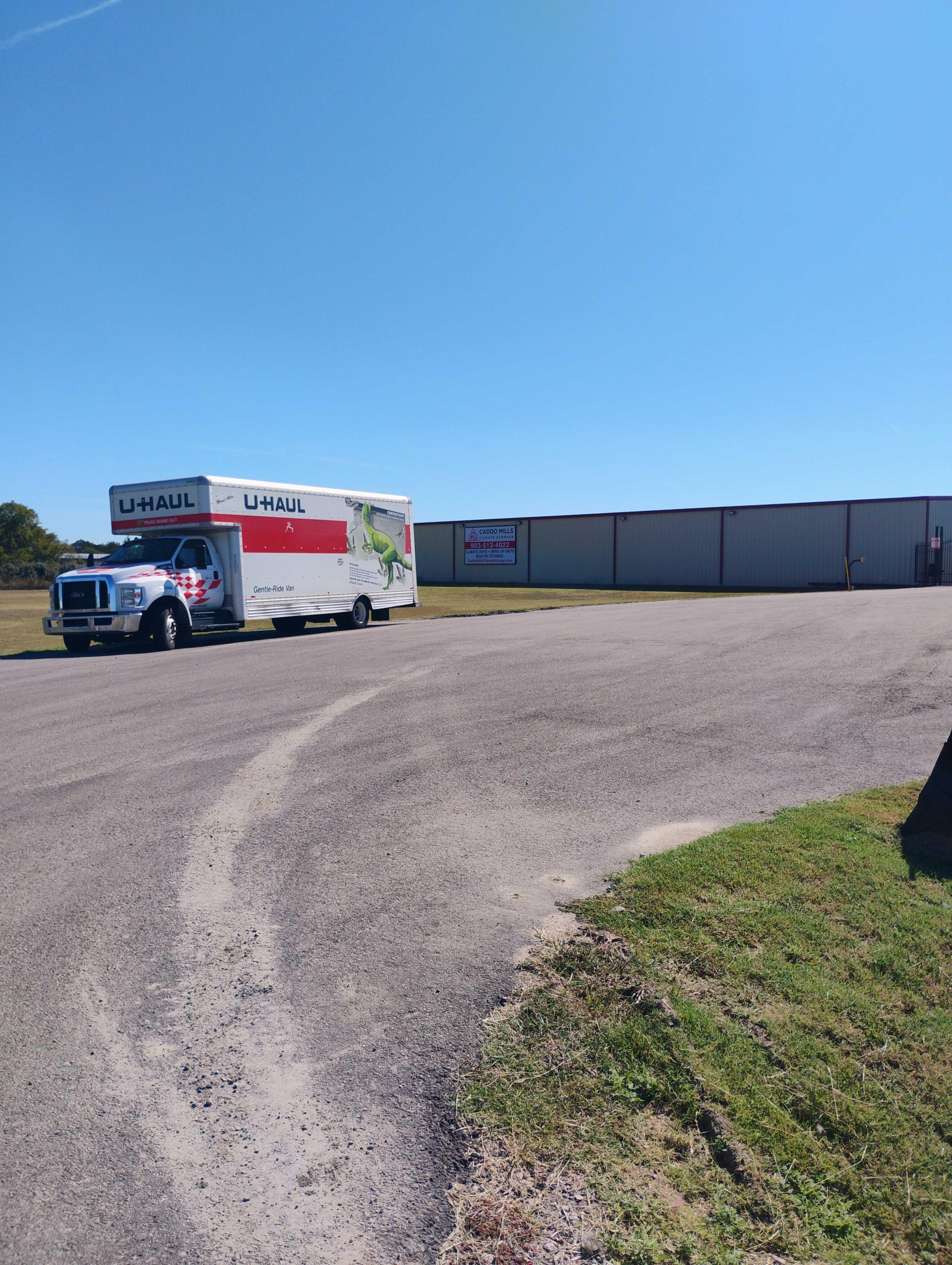 Secure company vehicle storage facility in Greenville with business trucks and vans parked under covered spaces.
