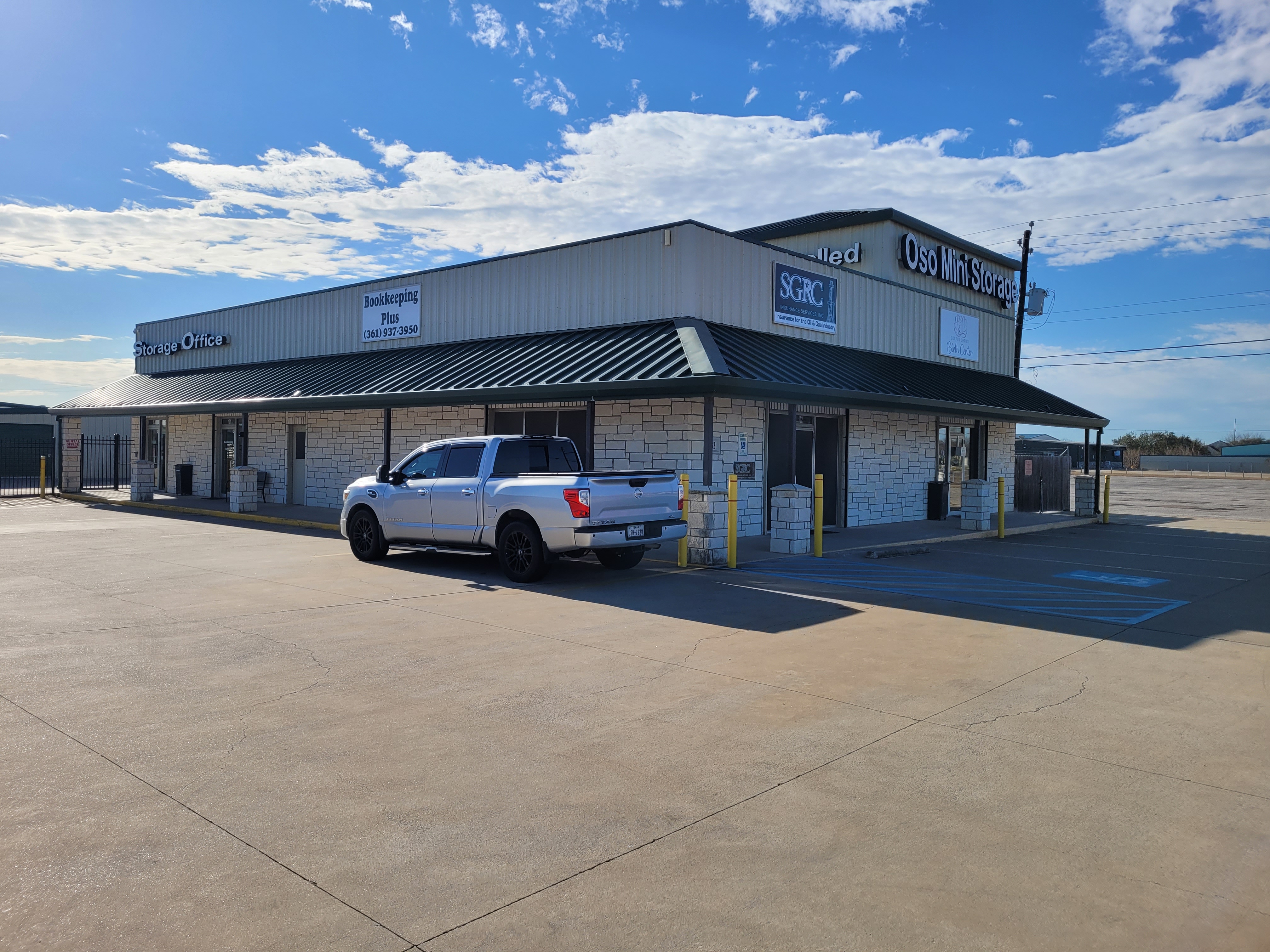 OSO Mini Storage Facility Front Office – Secure Storage with Smart Monitoring in Flour Bluff Corpus Christi TX Front exterior view of OSO Mini Storage office in Flour Bluff, Corpus Christi, TX, showing parking area and signage—secure storage facility with advanced smart monitoring.