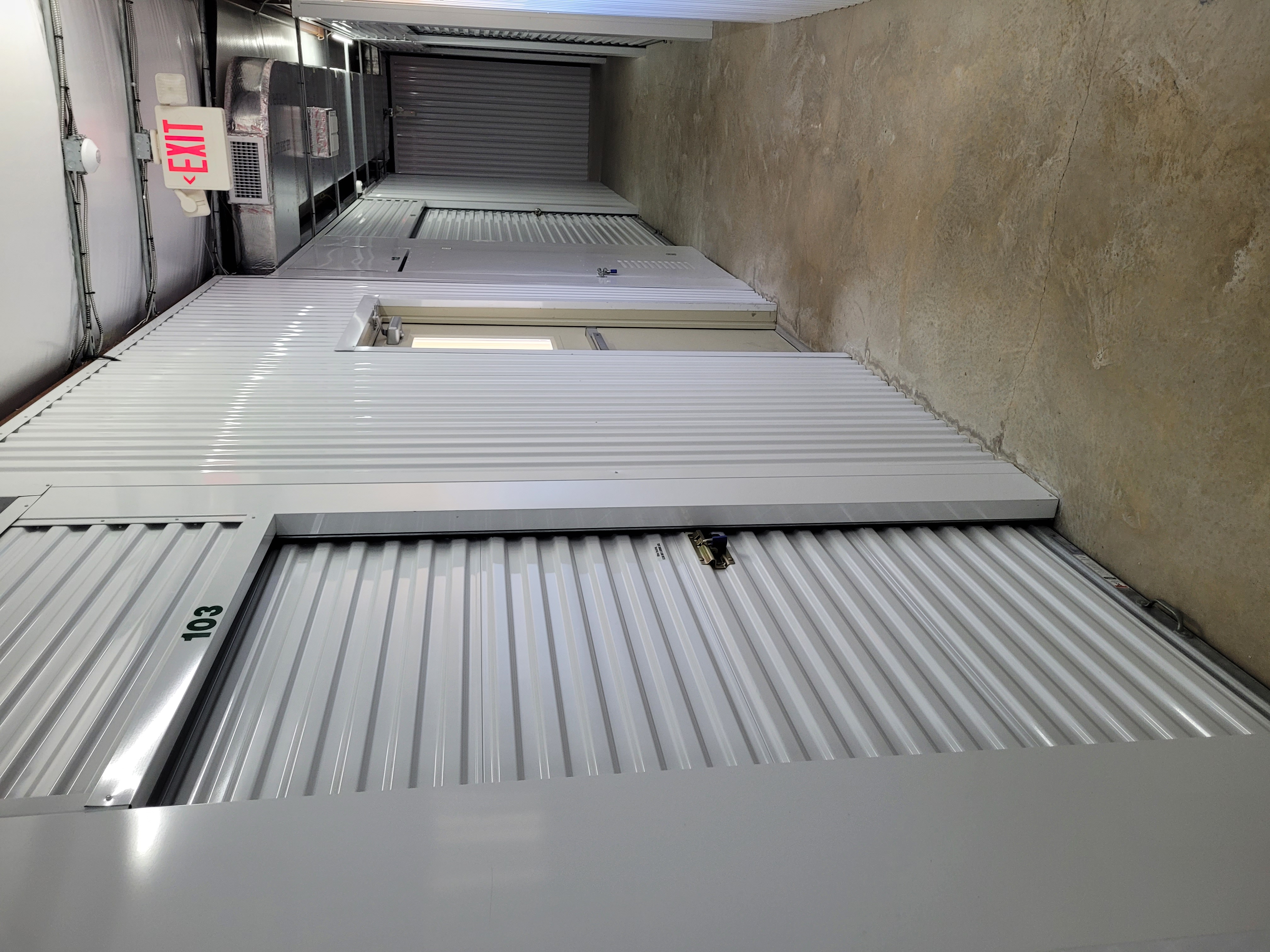 Climate-Controlled Storage Hallway – Maximize Storage Space in Flour Bluff Corpus Christi Interior hallway of climate-controlled storage units at OSO Climate Storage in Flour Bluff, Corpus Christi, TX, showing secure roll-up doors and clean, organized access space.