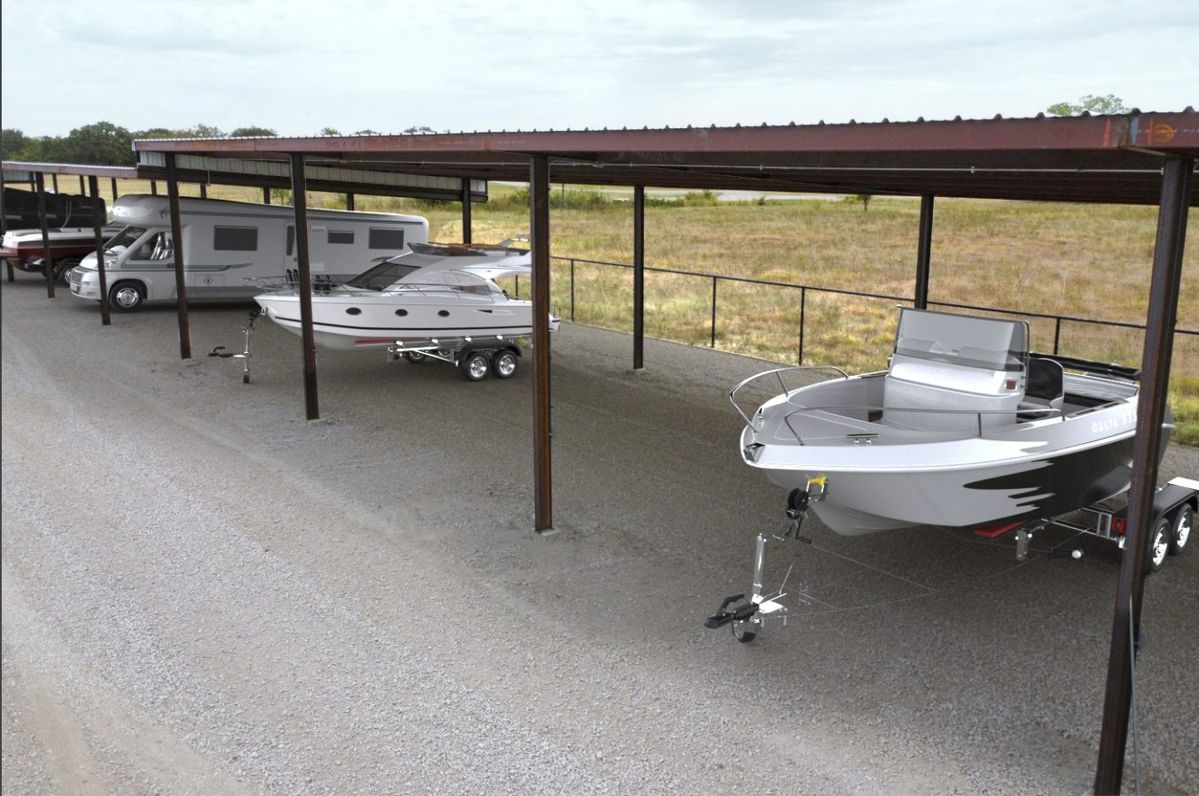 Boat and RV parking in Caddo Mills, TX, at a secure outdoor storage facility before the summer season