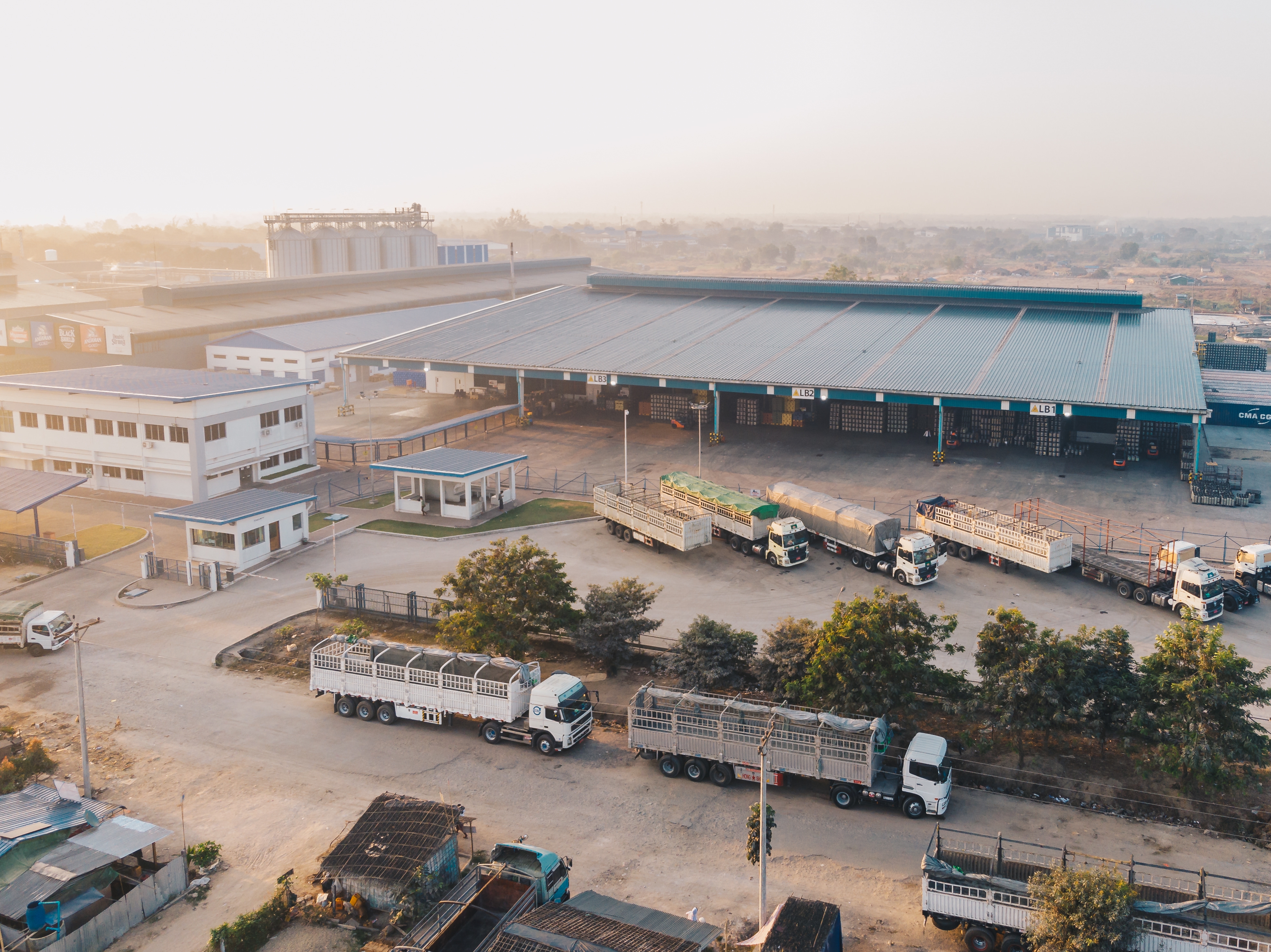 Commercial vans and work trucks parked in a secure gated facility for fleet parking in Waxahachie, TX