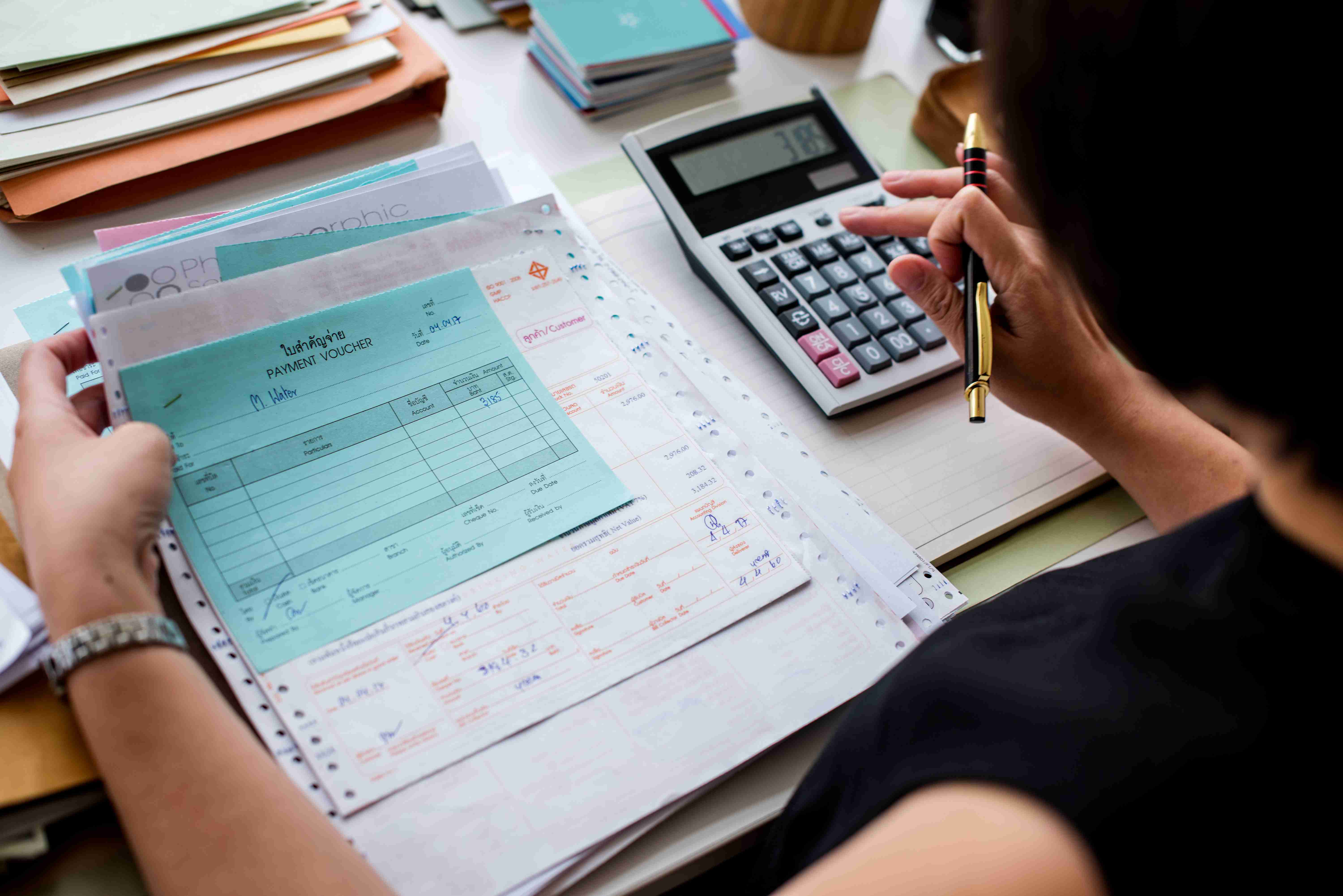 50% Off Storage Unit Promotion Savings Person calculating savings from a 50% off storage unit promotion at a Texas self-storage facility