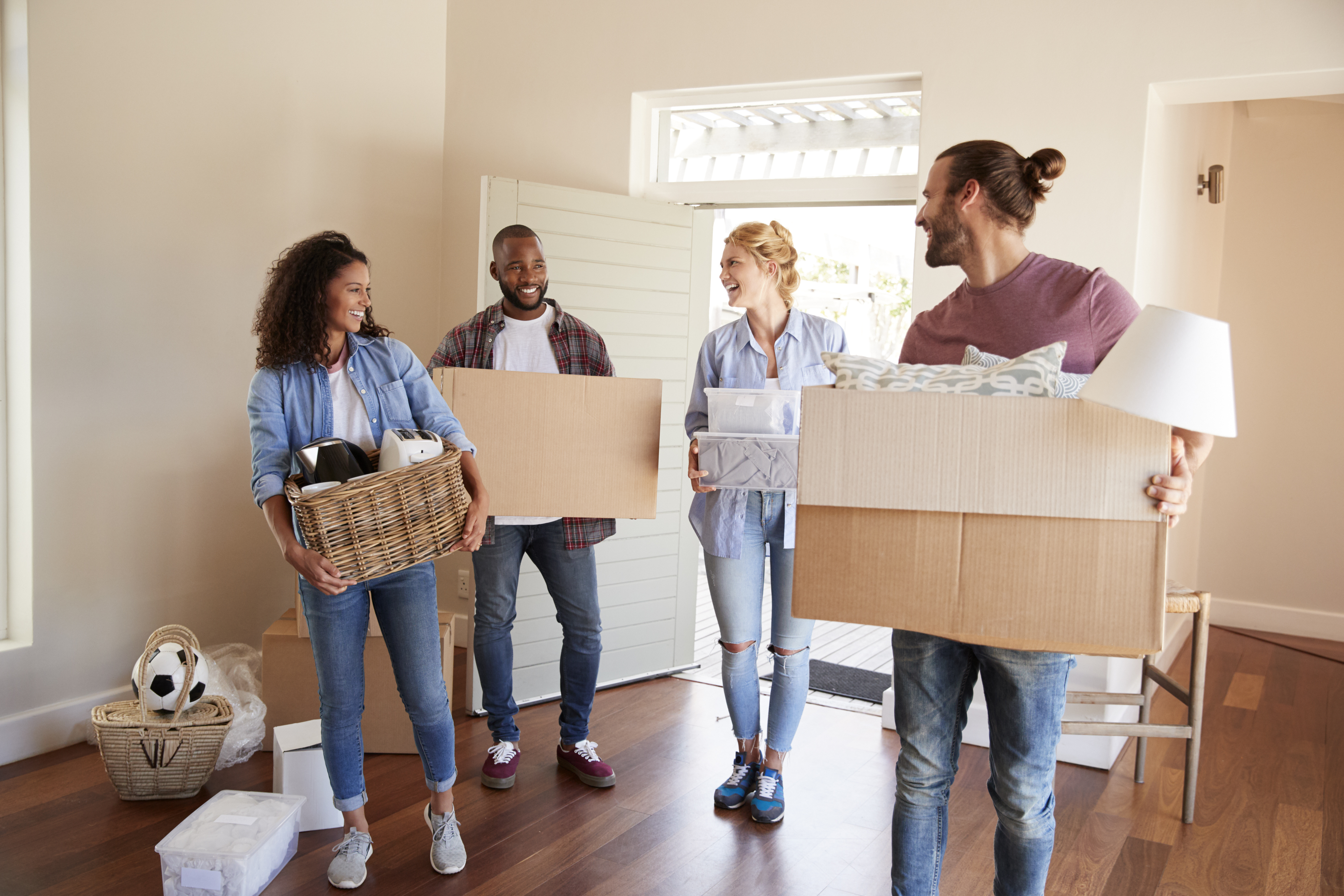 College students packing boxes during move-out season for summer storage in Central Texas