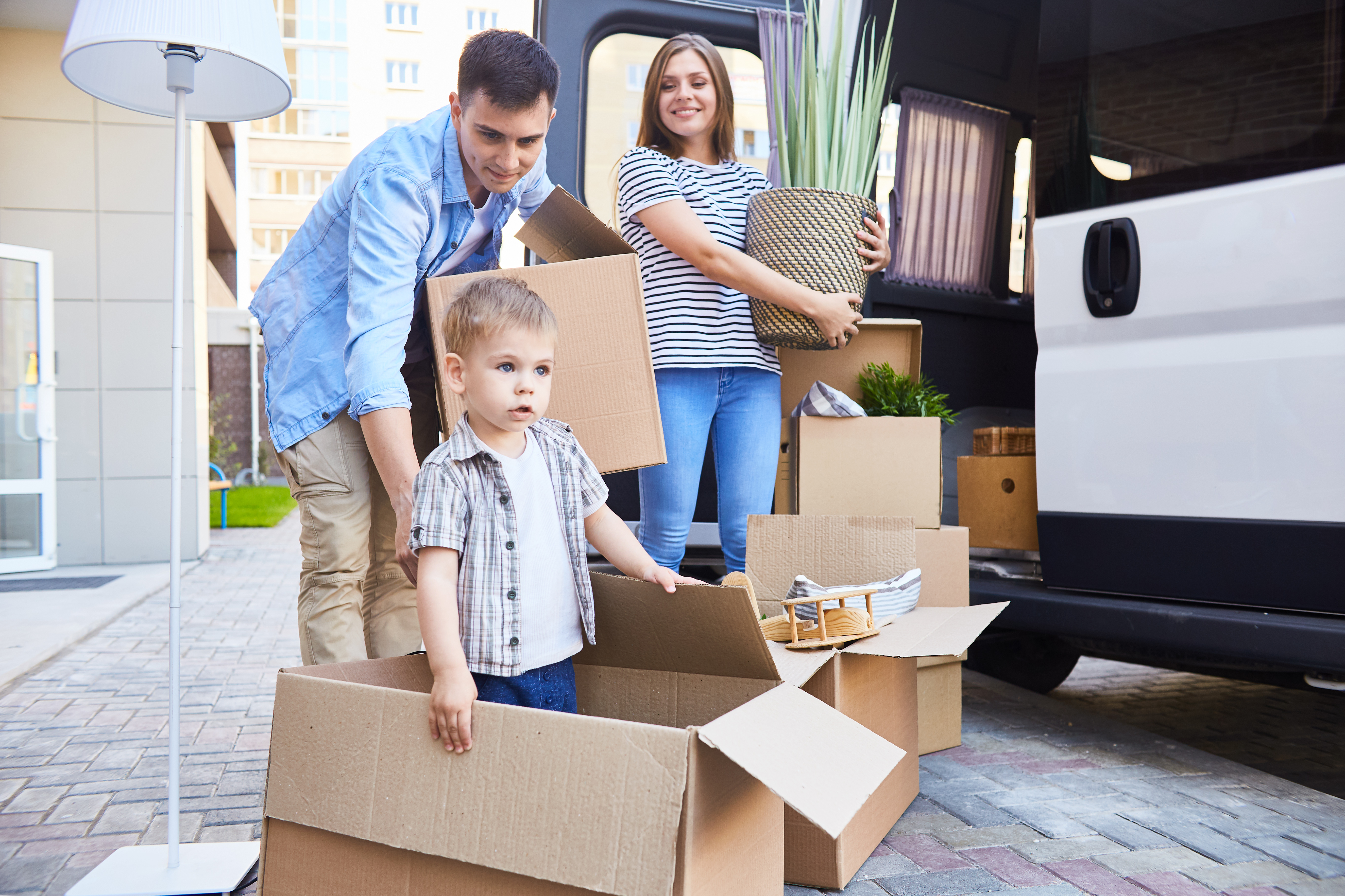 New residents unpacking boxes in a Dale, TX home using nearby self-storage to settle in comfortably