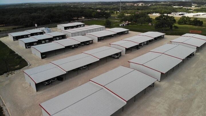 Covered RV and Boat Storage Facility in Boerne TX β Secure & Spacious Parking Near Bergheim Aerial view of covered RV and boat storage facility near Boerne and Bergheim, Texas with wide drive aisles and secure parking units