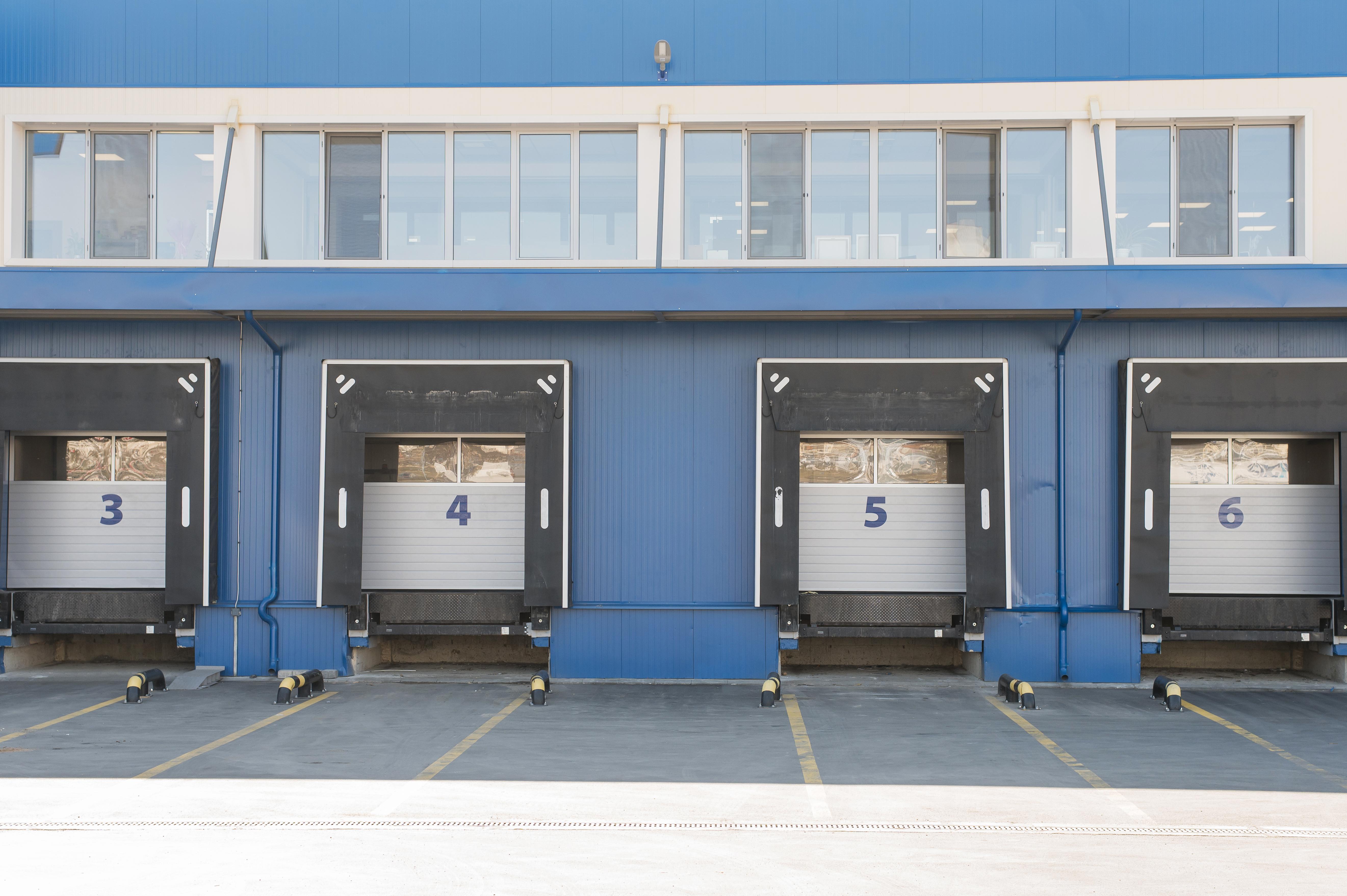 Drive-up standard storage units at a secure Texas self-storage facility on a sunny day