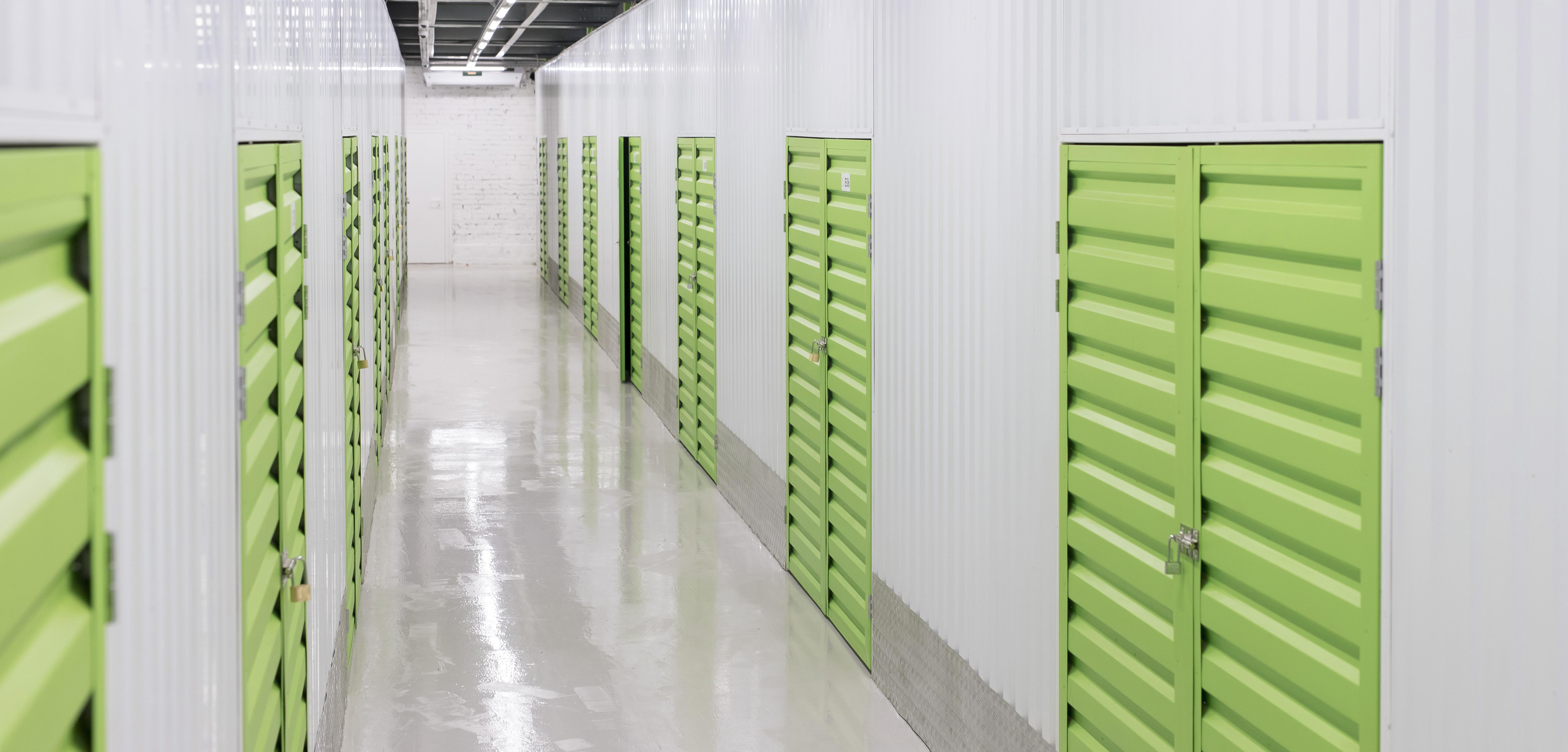 Clean modern storage units with open doors during spring in Spicewood, TX