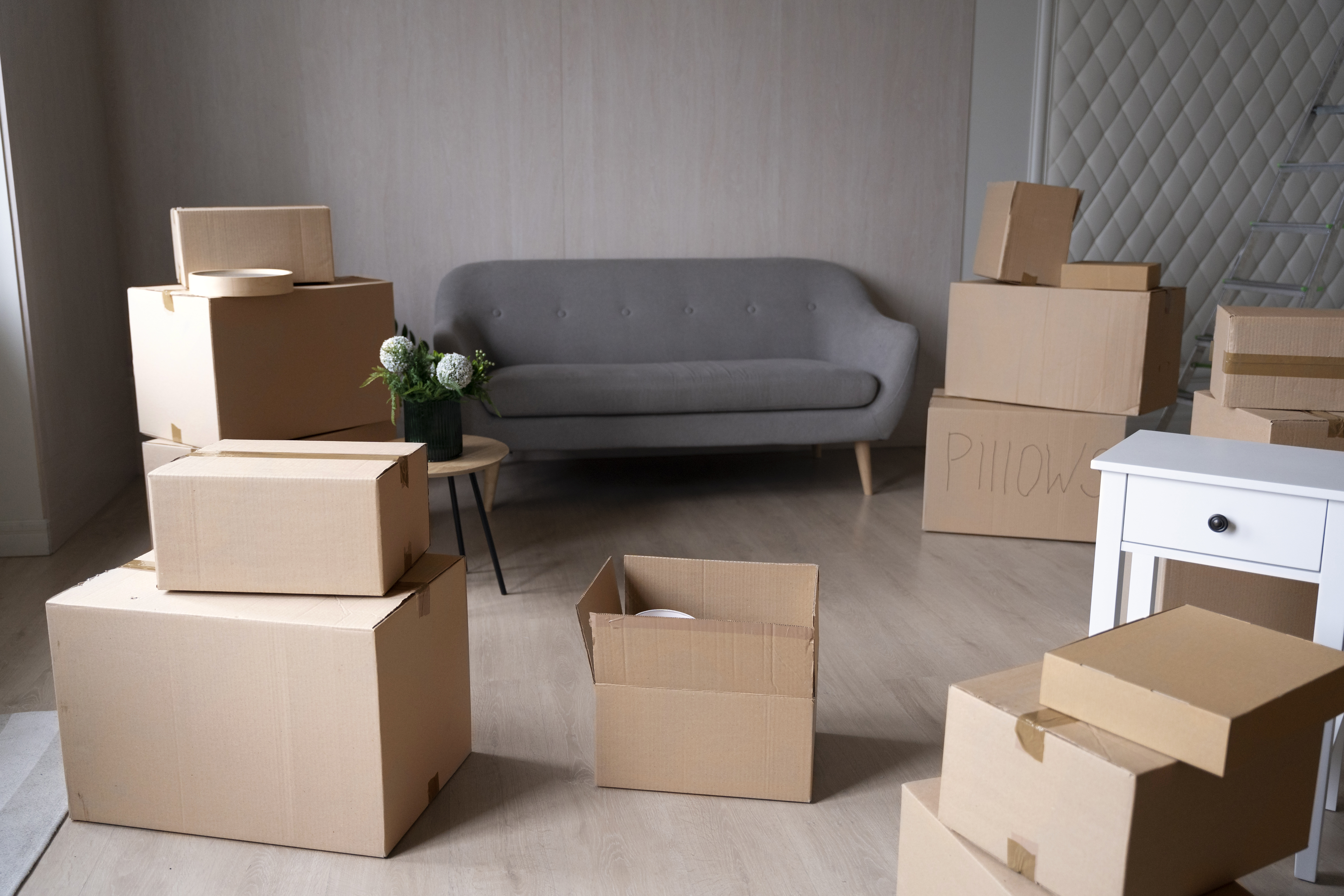 Homeowner organizing boxes for spring cleaning storage in North Richland Hills, TX