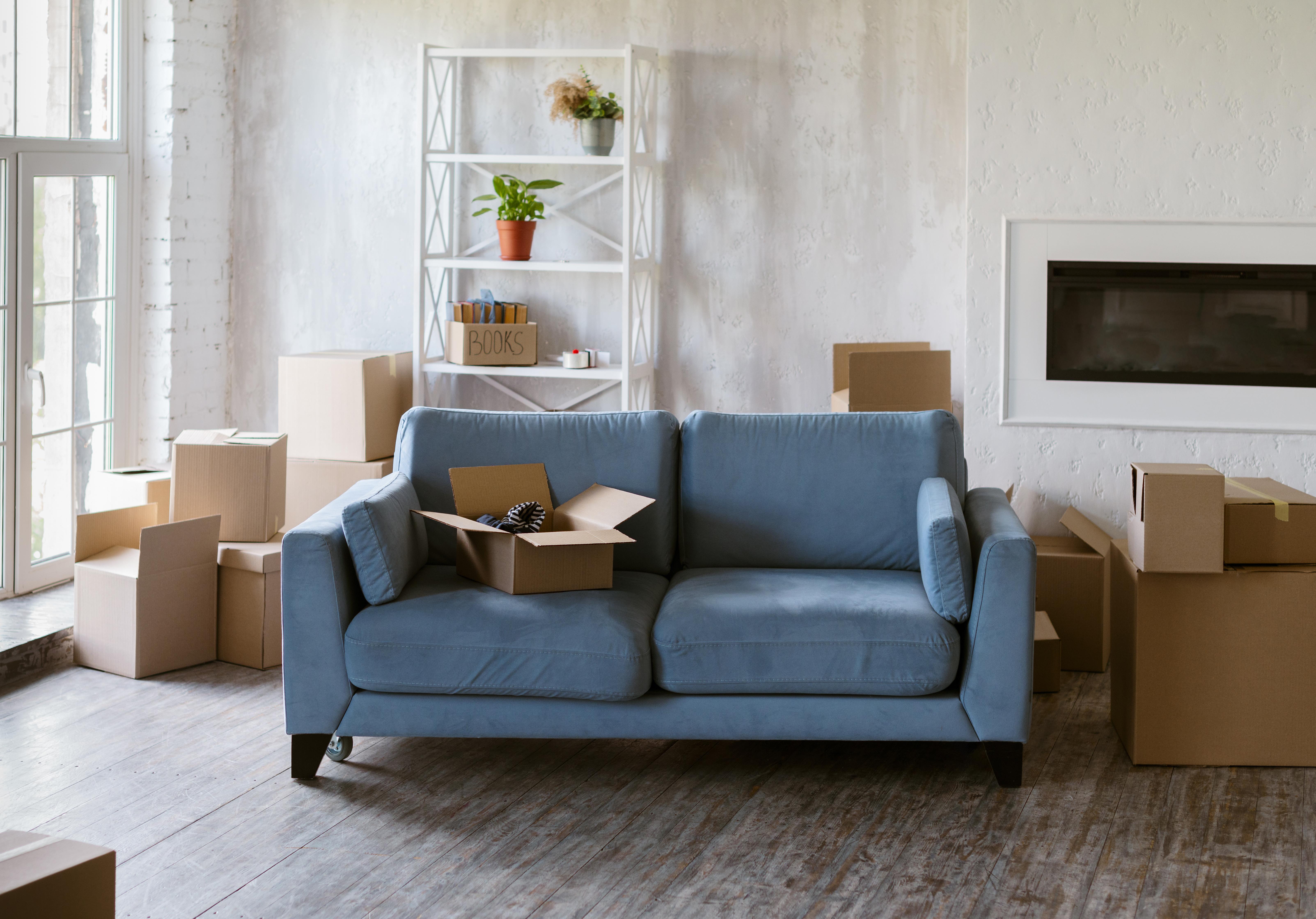 Living room with moving boxes during home staging preparation — Athens TX storage tips for home sellers