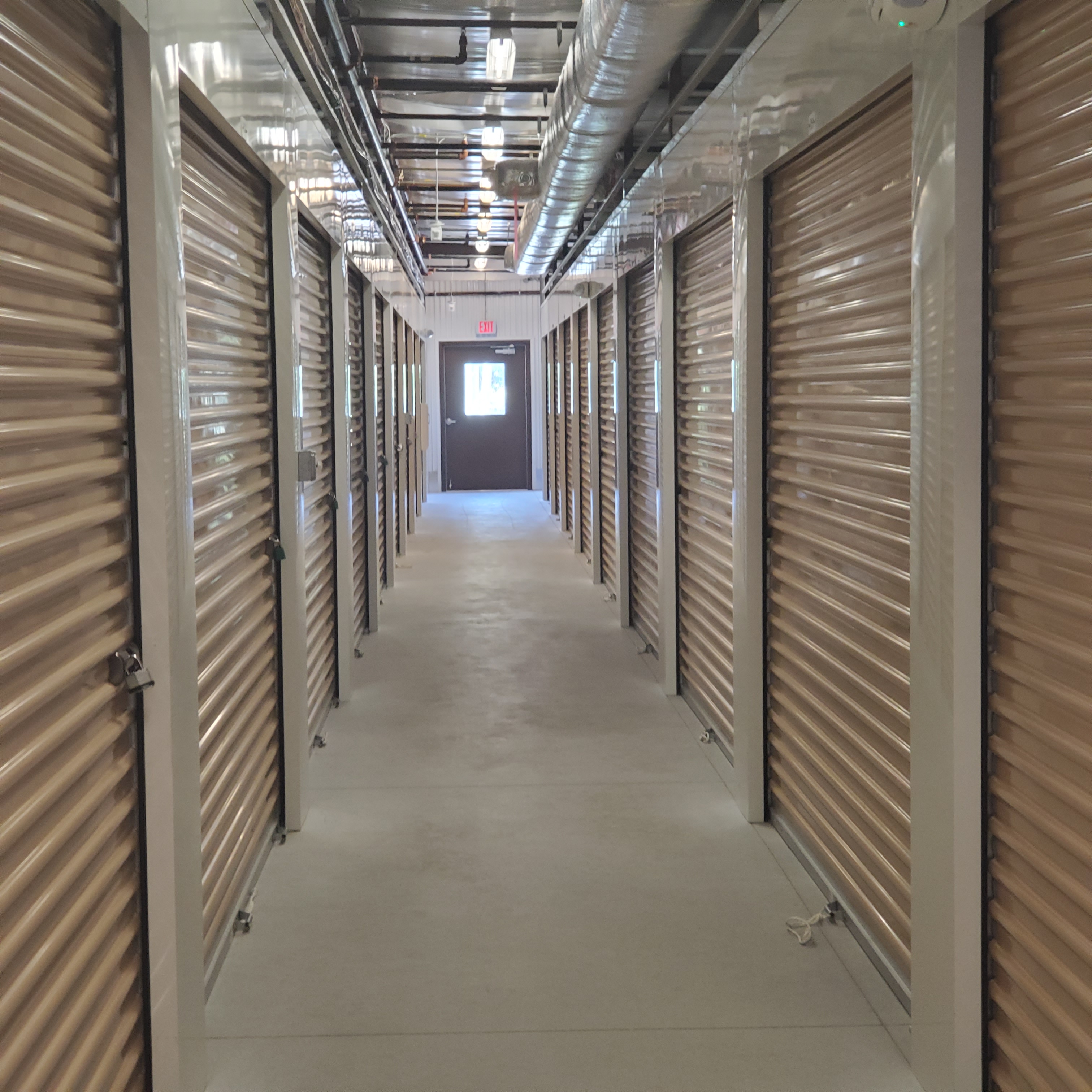 hallway of interior storage units with doors closed