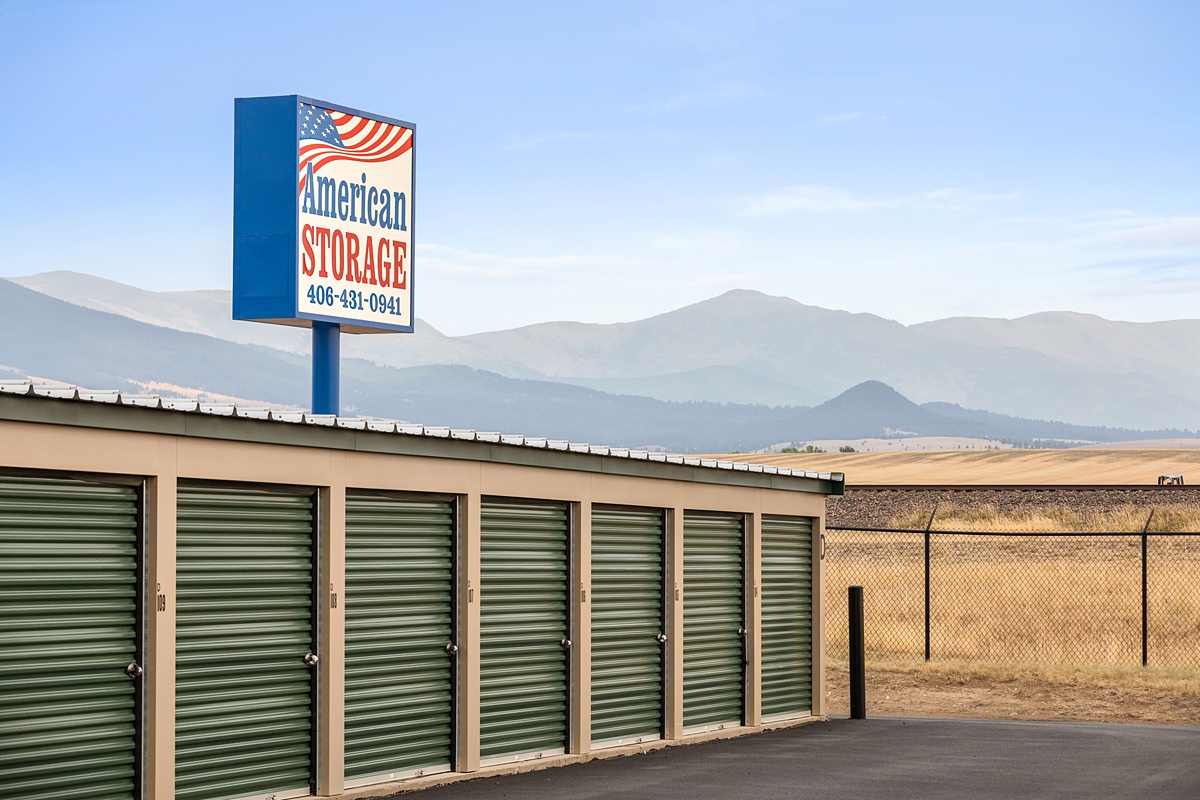 American Storage Sign above a storage building with drive up doors