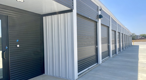 outdoor access self storage units and entry door to interior of building