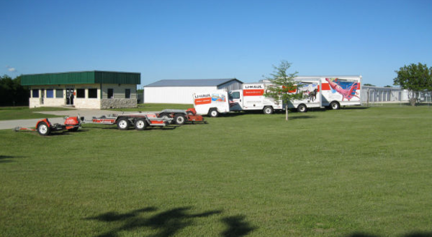 moving trucks and trailers parked at krum self storage in denton, tx