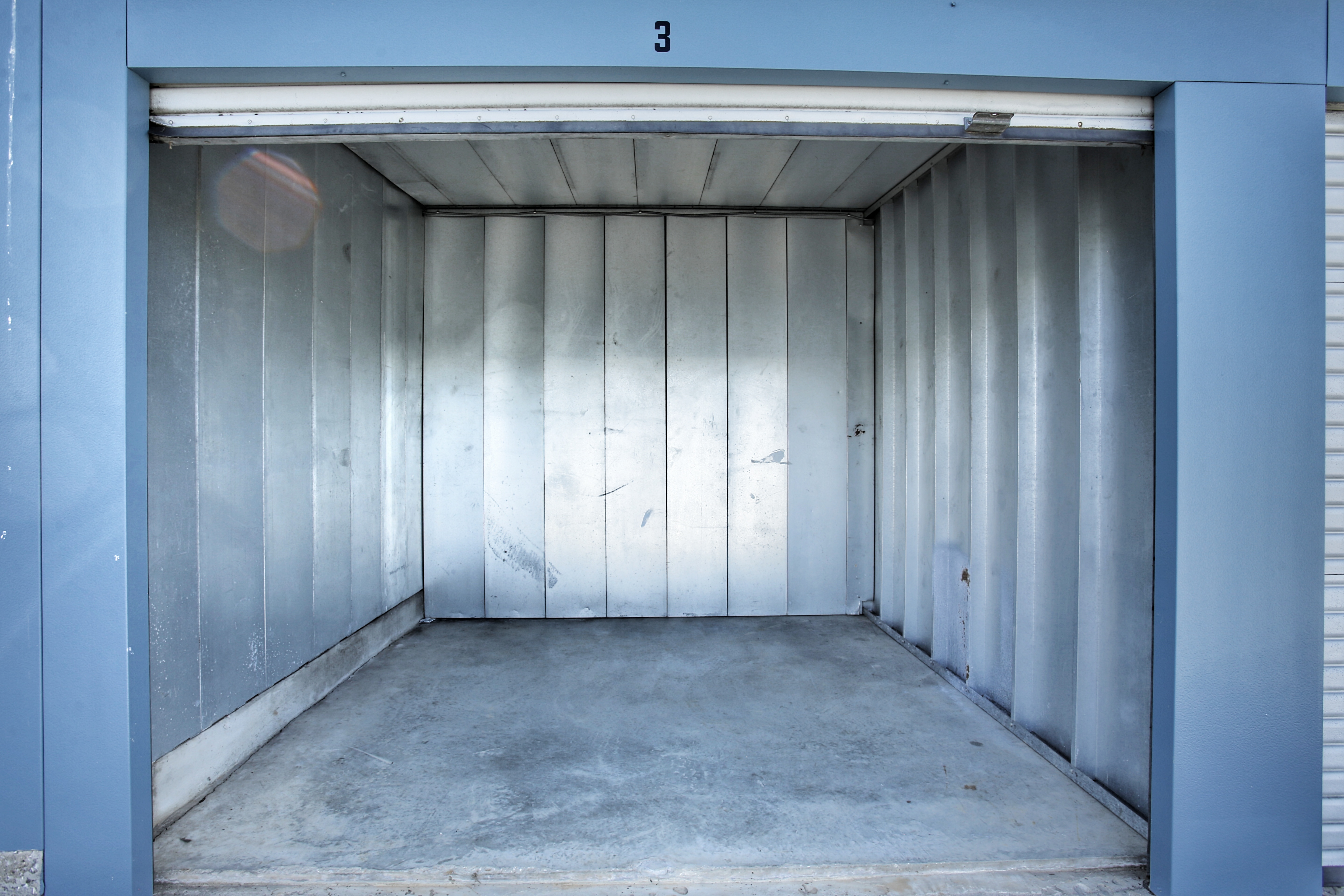 Interior of a clean self storage locker with a roll up door in Eldersburg, Maryland 