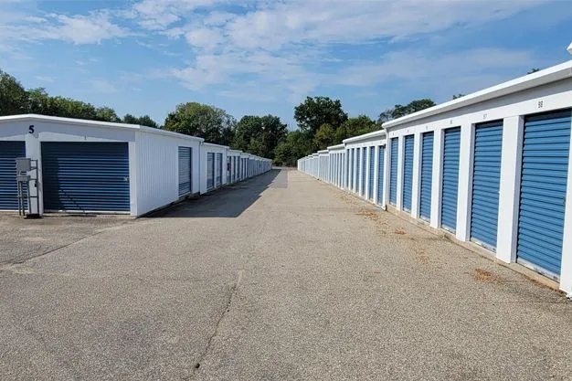 Exterior view of Ellicott City storage facility with drive-up units and secure gate