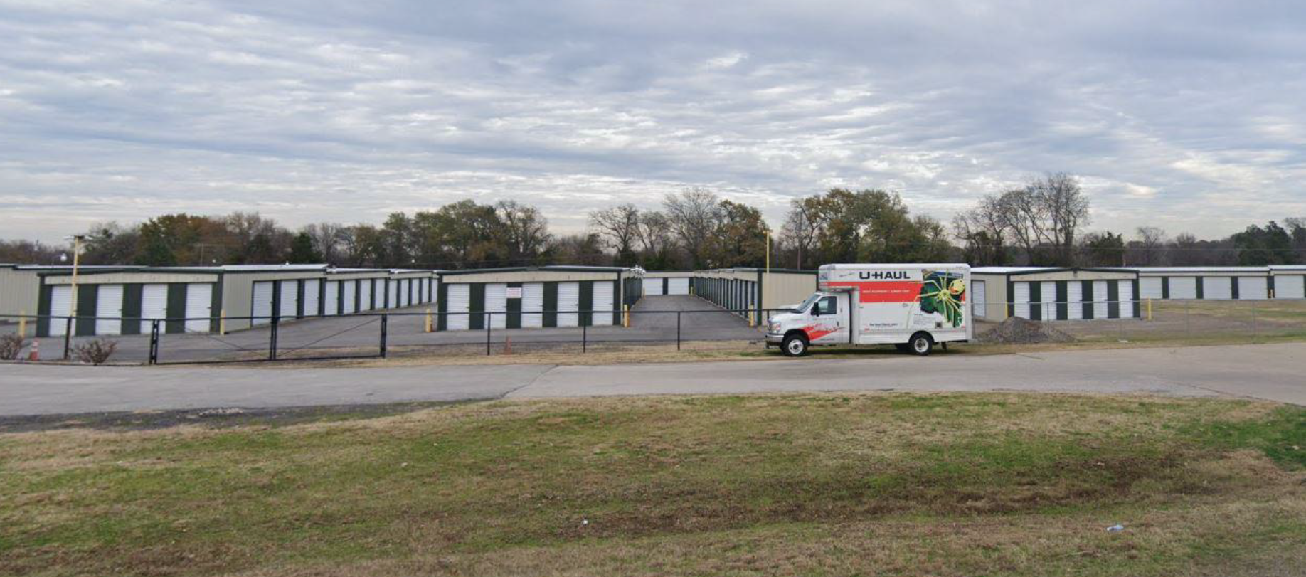 storage facility with full perimeter fence and rental truck