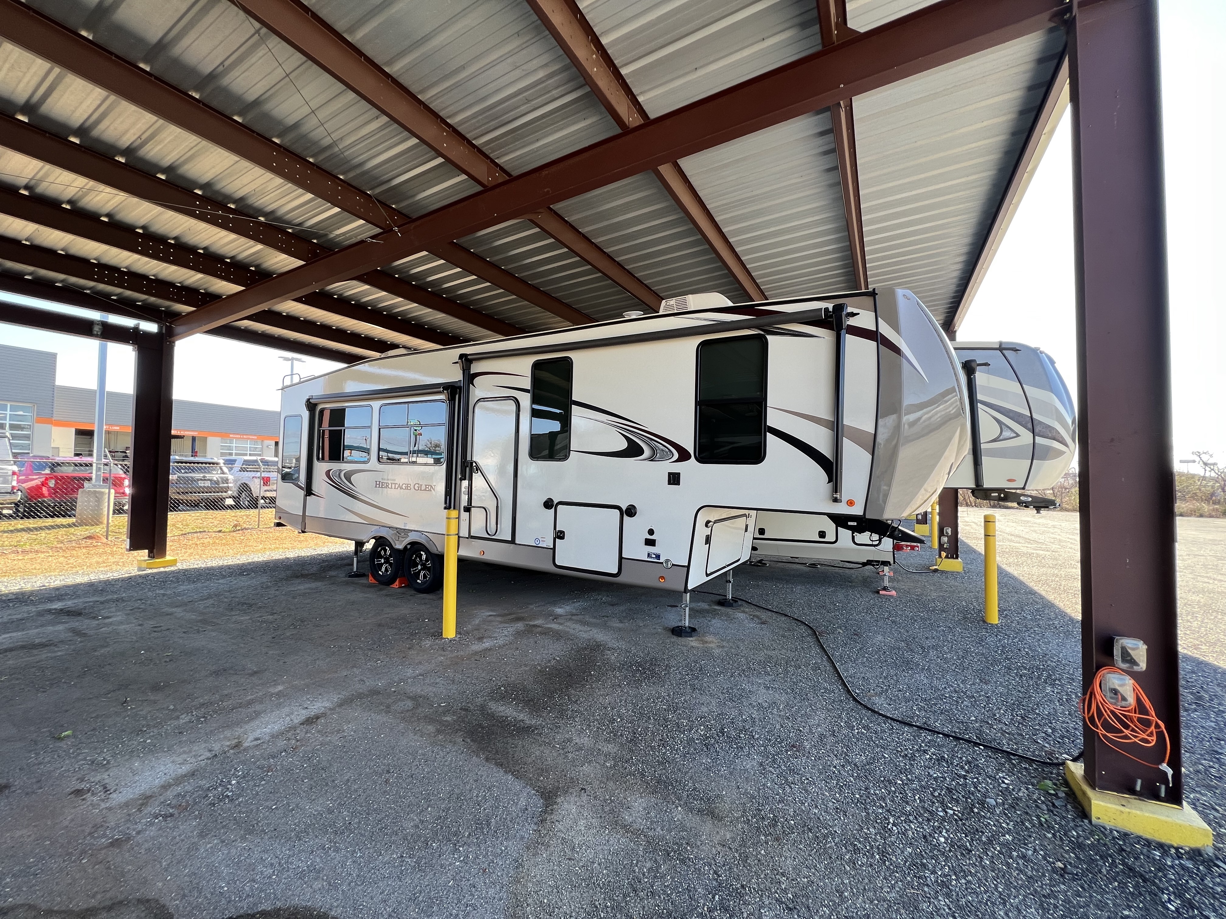 Covered RV and boat parking with power hookup in Byron, GA