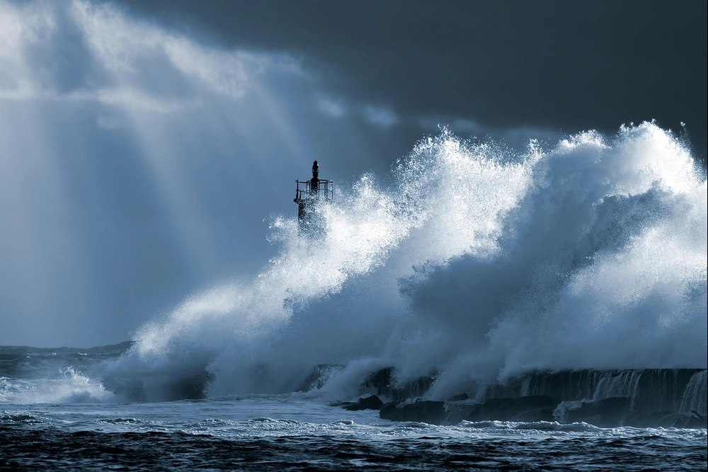 Huge wave hitting a Lighthouse