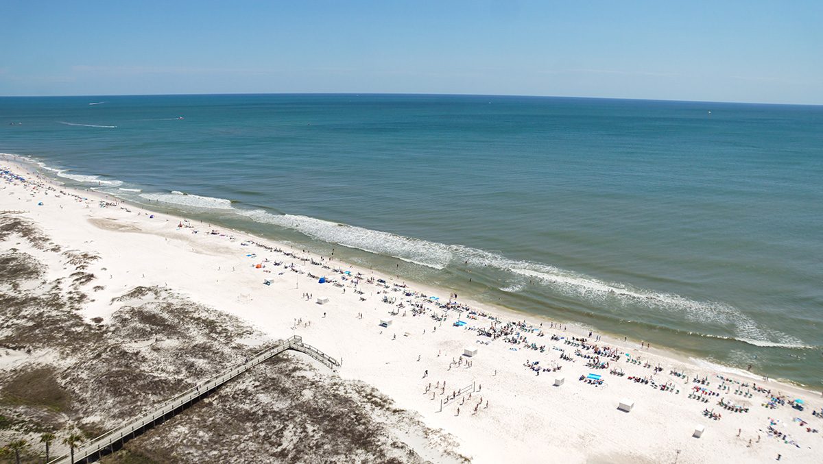 Beautiful white sand beach at Gulf Shores, Alabama. A bird's eye view of the beautiful white sand beaches that line the Gulf of America. A coastal paradise!