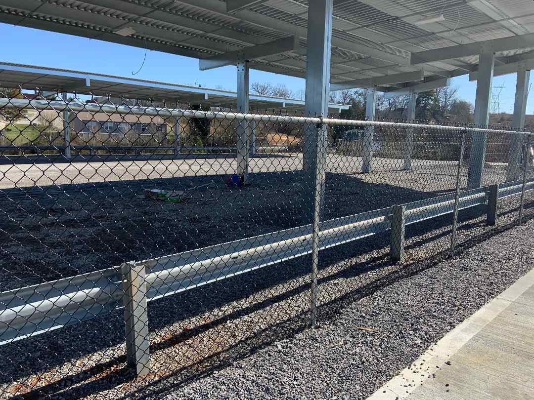 Covered storage facility with secure perimeter fencing