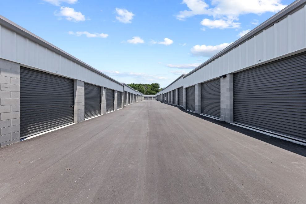 Row of drive-up storage units with roll-up doors